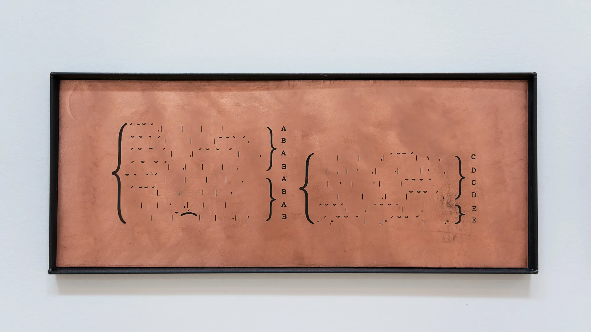 Kaja Clara Joo, 다시 : DASI, 2026, detail. Copper plate in black steel frame with engraved musical notation and text: your self: defects of every friend — and every foe. Korean Culture Center Vienna.