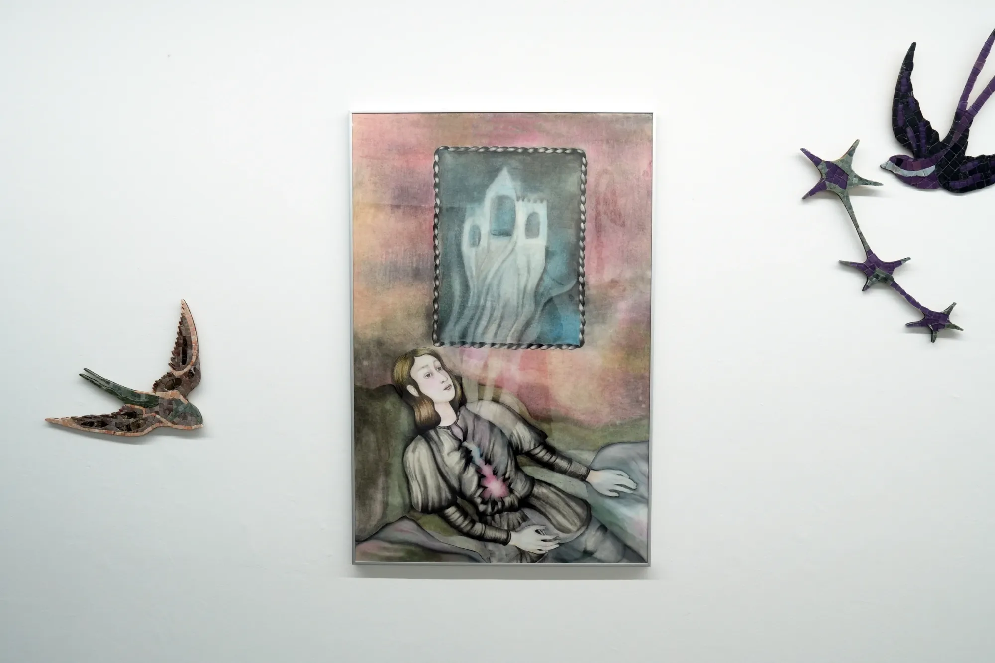 Nata Varazi, Untitled, 2025 — framed drawing depicting a reclining female figure with a glowing heart motif and a ghost-like architectural form above, rendered in soft gradients of pink, grey, and green; watercolor pencil, oil pastels and pencil on paper; The Why Not Gallery at Fabrika Project Space, Tbilisi.