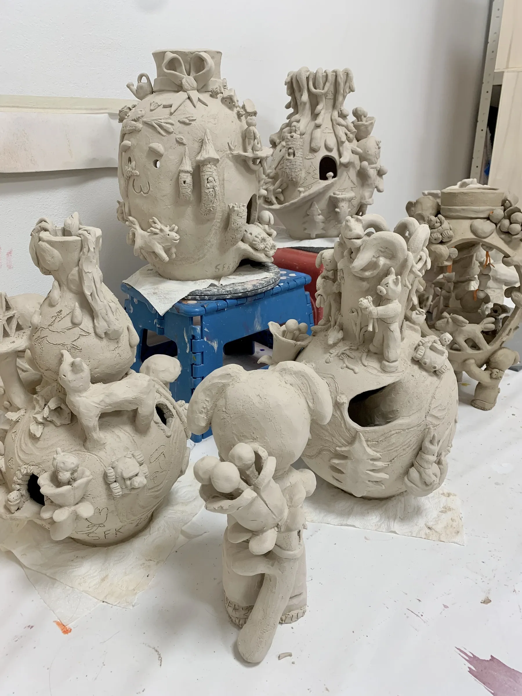 super future kid, artist, and art work with  new ceramics , raw, figurative vessels 