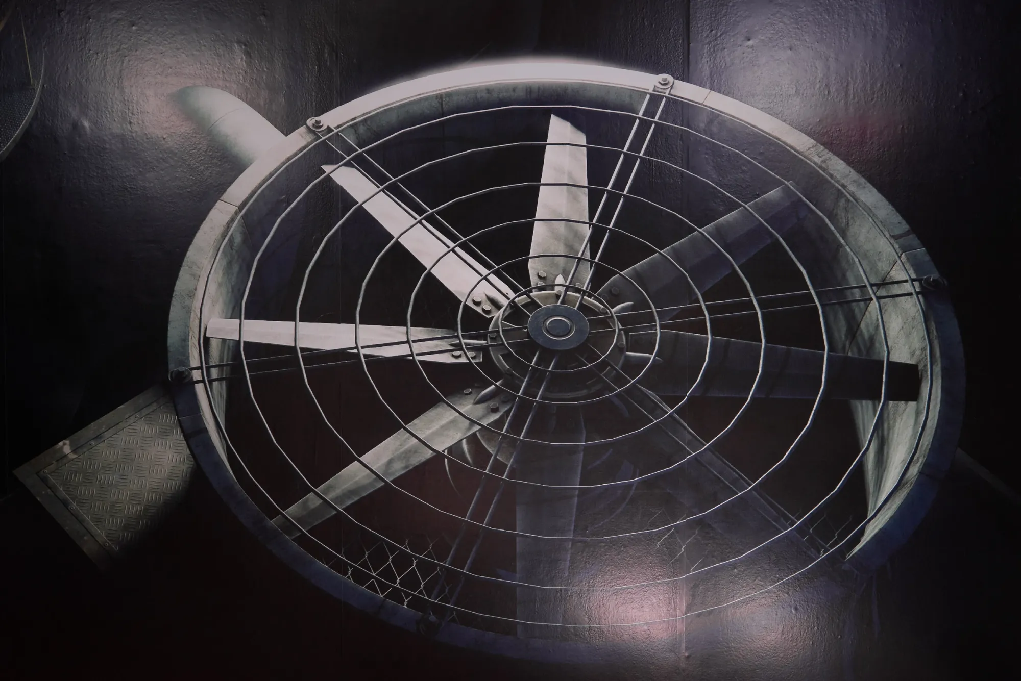 Anna Engelhardt and Tina Bxtq, Bleed Through, Galerie 35M2, Prague, 2026, close-up detail of industrial fan image on dark wall
