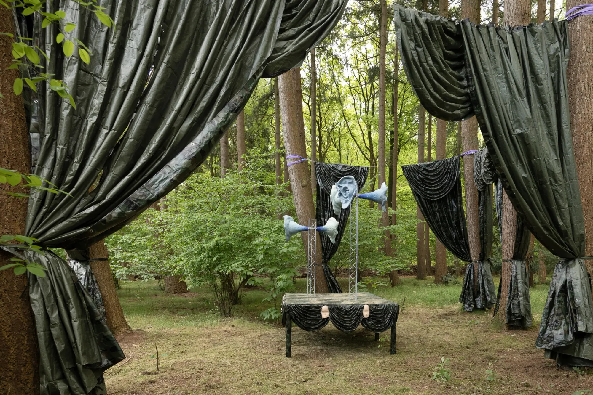 Katharina Busl, Nothing Up My Sleeve, PaltzBiënnale Soest 2026, interior view with curtains parting and face-form on central truss