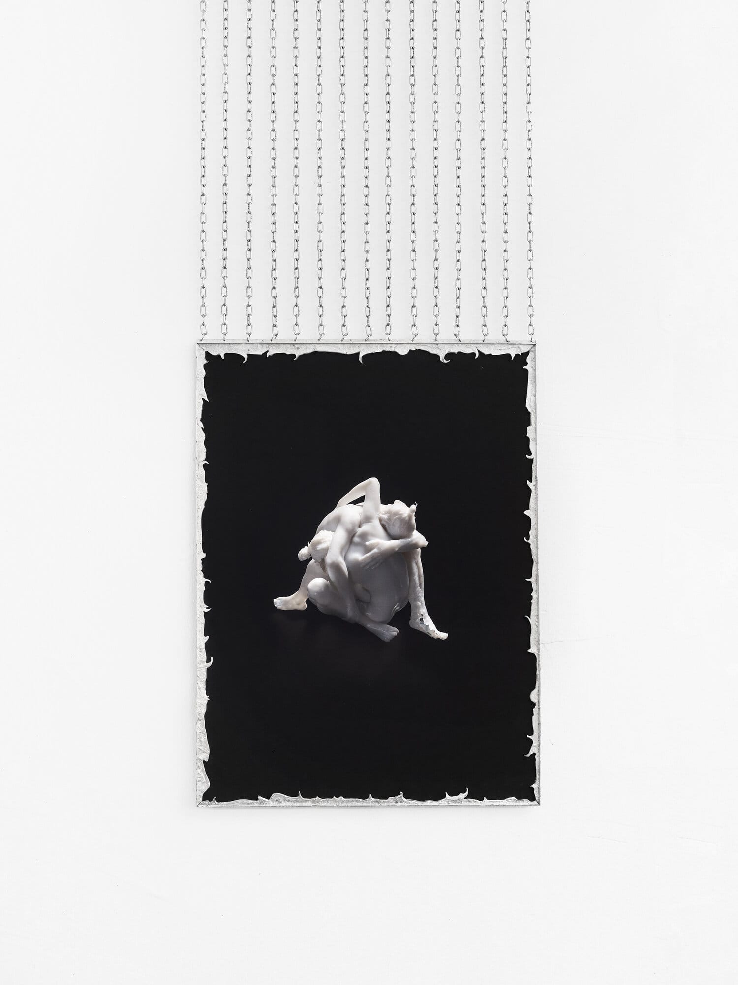 lom-of-LaMa, framed photograph of two intertwined bodies on dark ground, suspended from ceiling by metal chains with decorative silver frame border, Call Me We, SUPERRAUM Dortmund, 2026