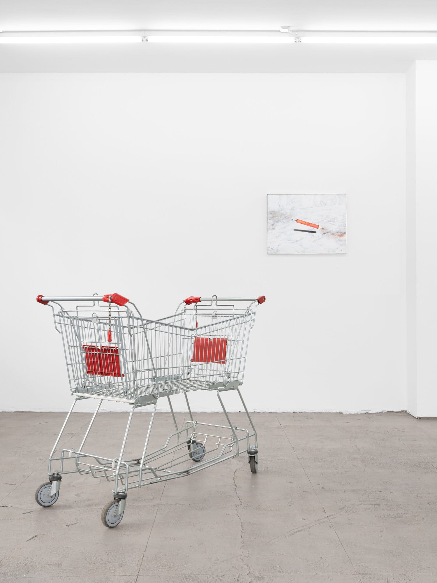 lom-of-LaMa, sculpture of two supermarket shopping carts welded together facing opposite directions, shared red basket elements, reinterpreted everyday object for dual use, Call Me We, SUPERRAUM Dortmund, 2026