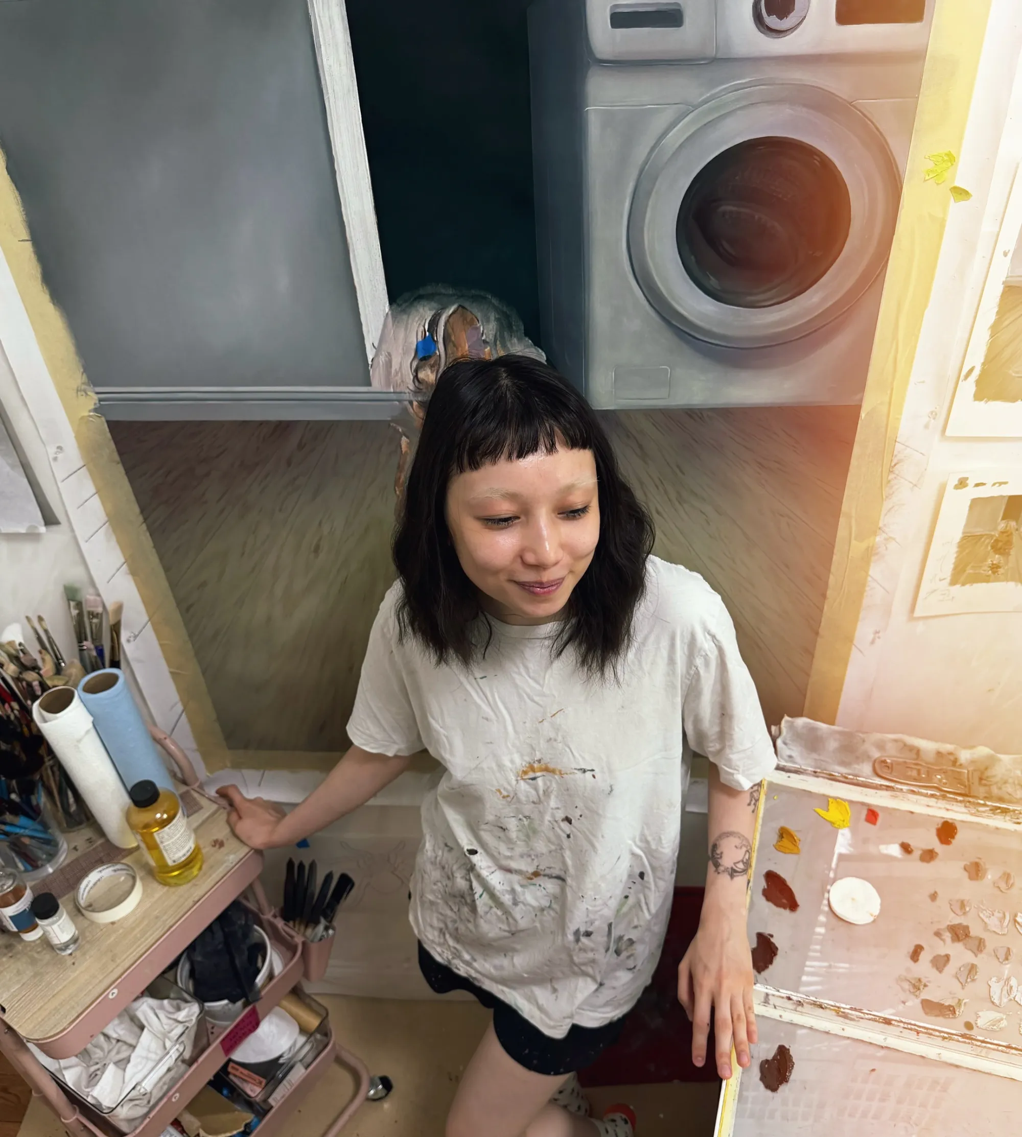 Rei Xiao artist portrait studio Brooklyn 2025, standing in studio with large canvas visible behind her