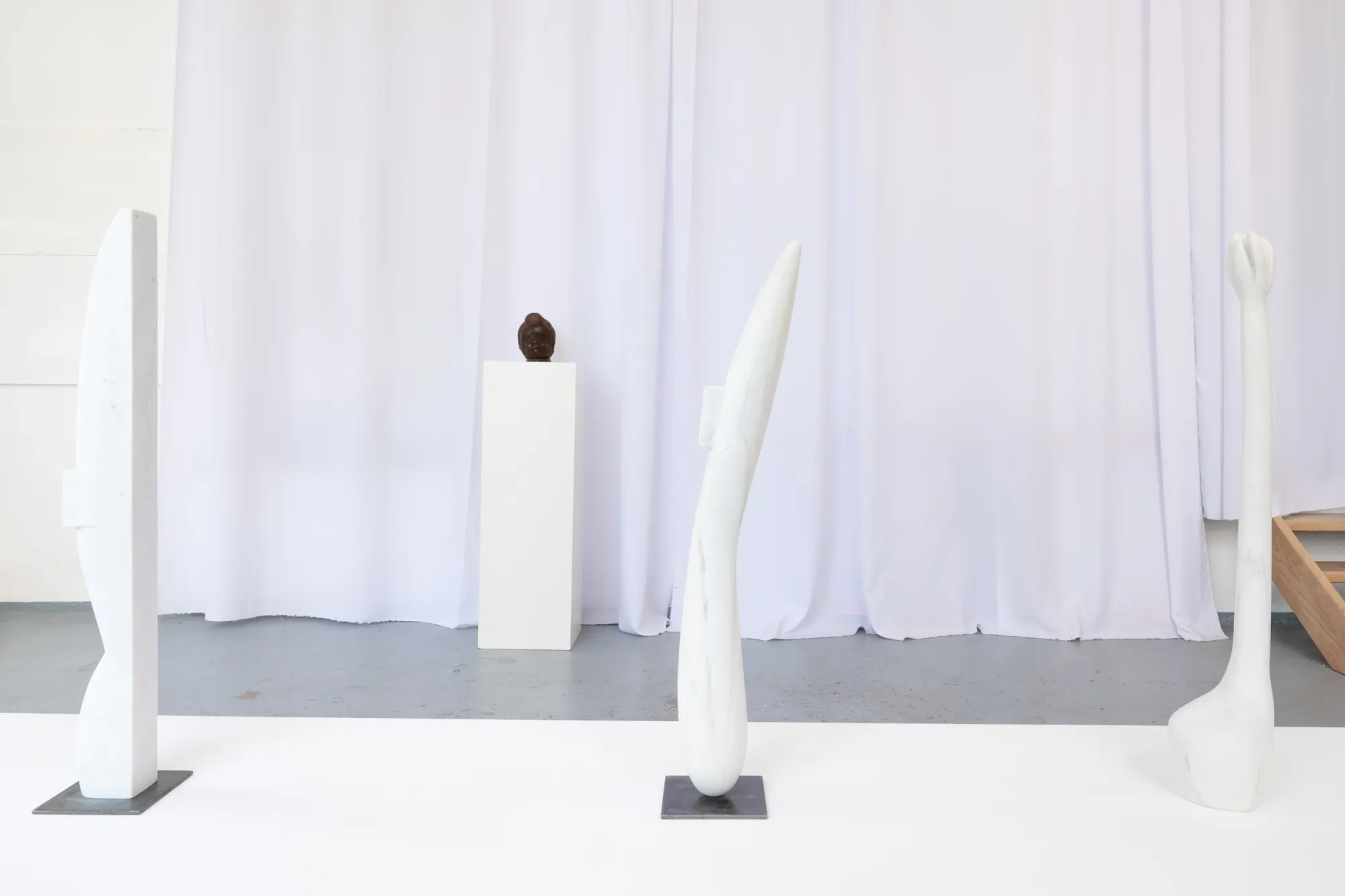 Charis Judith Smith, We Are Being Carried Somewhere, studio, Berlin, 2026, wide studio view with sculptures and natural light