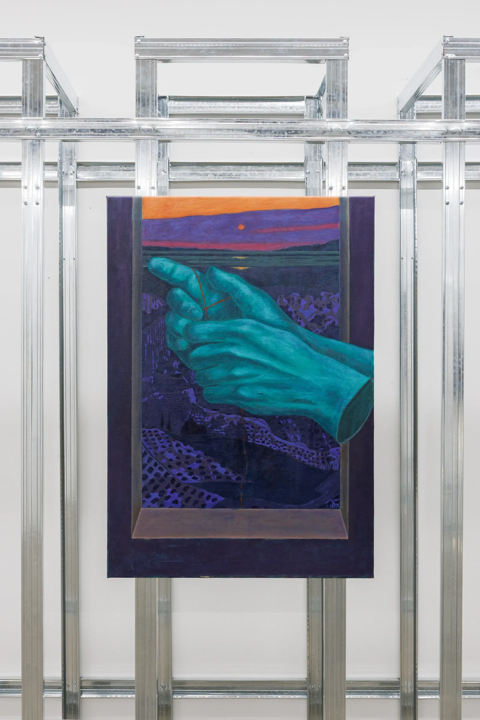 Exhibition review of Erekle Chinchilakashvili: The Story of a Thread Seen From the Window at The Why Not Gallery, Tbilisi, 2026, installation view, angled view of a teal painted hand against a deep purple ground, mounted within the steel frame