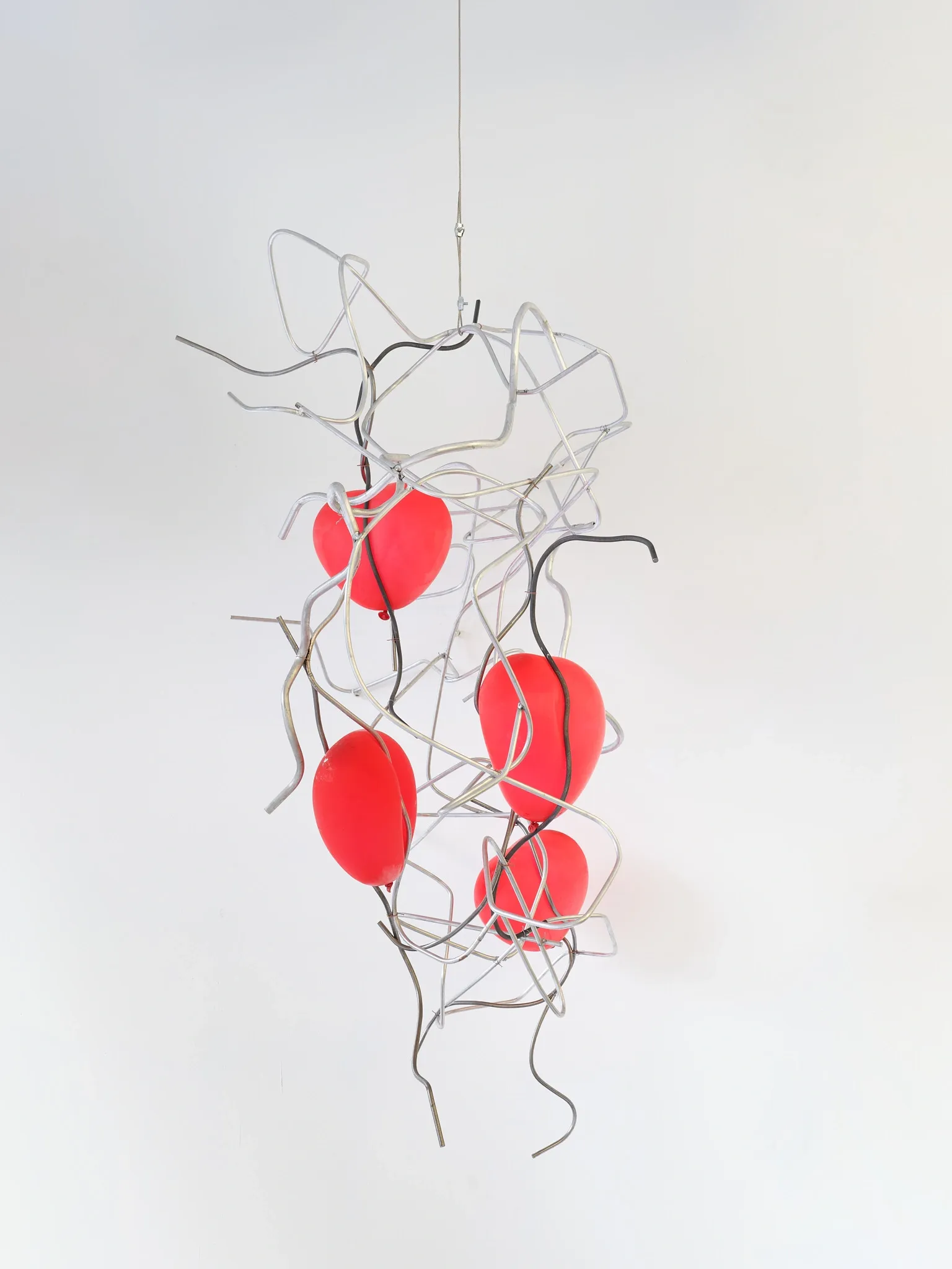 Hannah Perry, Hard Love, Tick Tack, Antwerp, 2026, hanging sculpture of bent metal wire and red resin forms