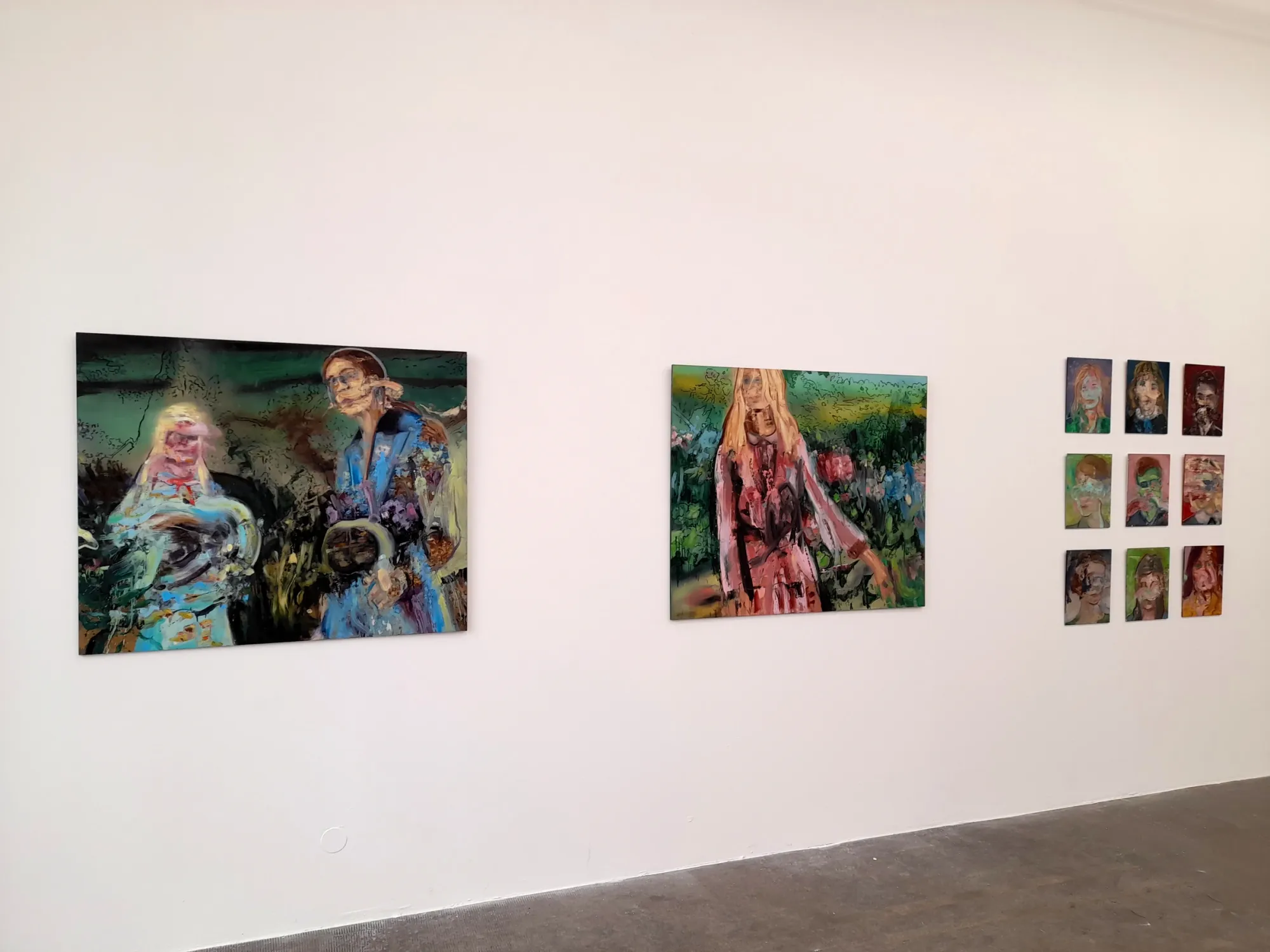 Leonardo Vargas, installation view, Fondation Fernet Branca, Saint-Louis, 2022, two paintings and a grid of small portrait panels on gallery walls