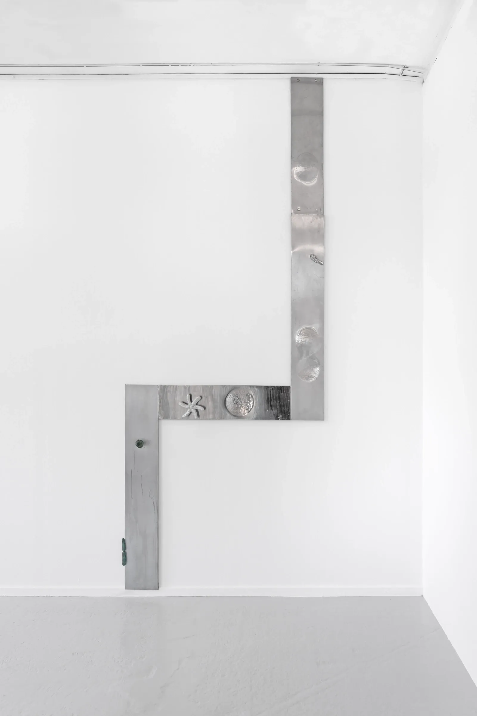 Matti Sumari, Object of Devotion, Skånes konstförening, Malmö, 2026, detail of aluminium wall sculpture with cast elements
