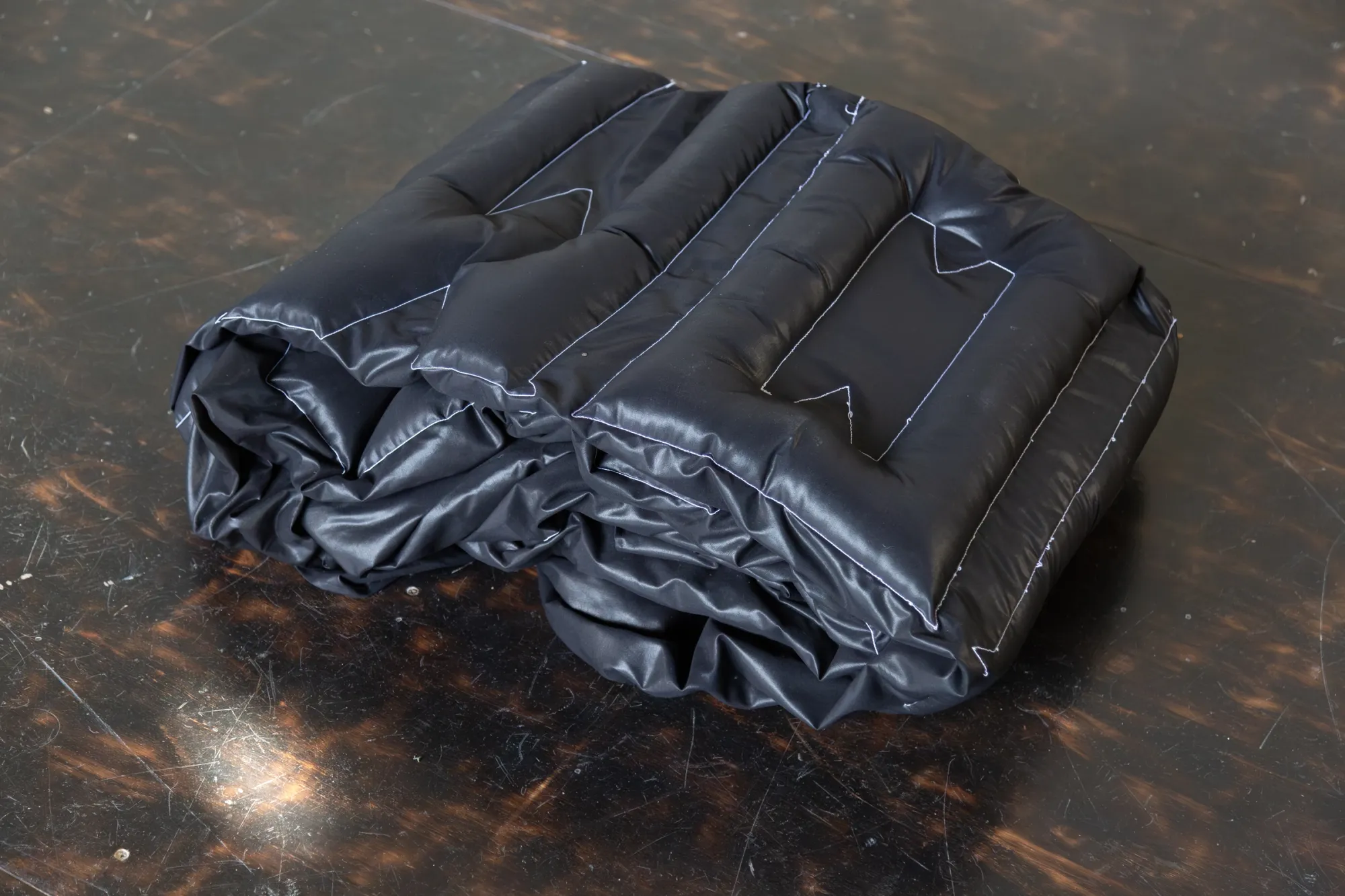 Nicola Genovese, Infinite Stage, detail, folded black padded Memento Mori banner fabric, Raleigh Chapel London, 2026