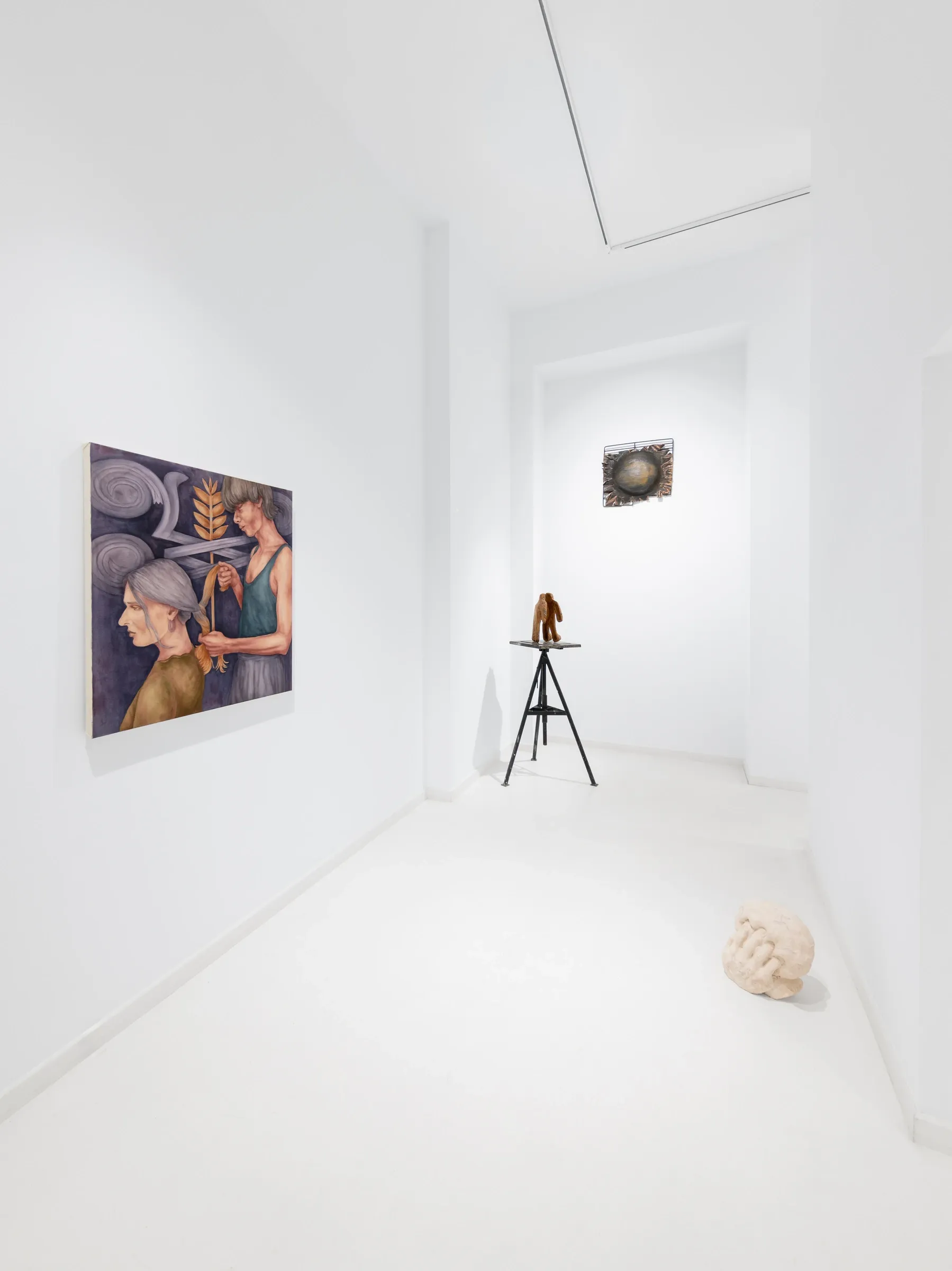 Maciej Nowacki and Miłosz Tomkowicz, Blood Concrete Sun, HOS Gallery, Warsaw, 2026, corridor with a painting of two figures braiding hair and a small wood sculpture