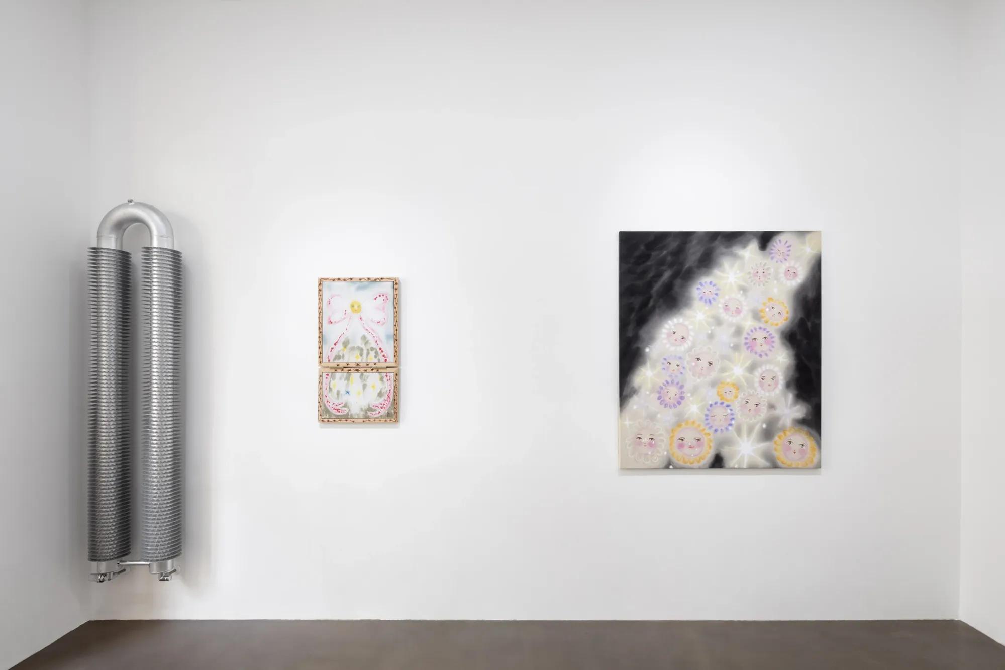 Olga Krykun, Stardust for Tomorrow, Clauda, Prague, 2026, steel radiator beside a bow painting and a dark star-face canvas