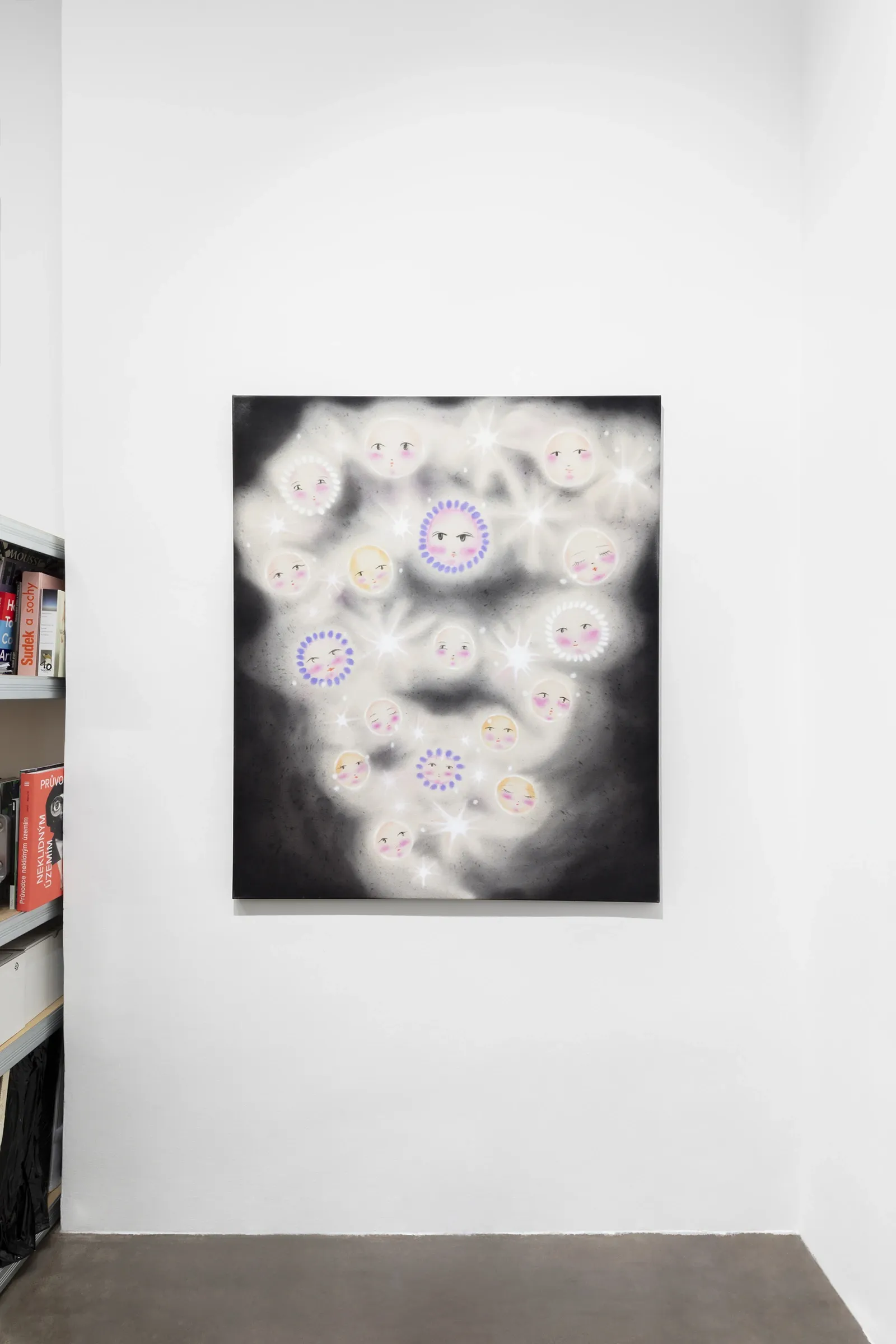 Olga Krykun, Stardust for Tomorrow, Clauda, Prague, 2026, dark canvas with small glowing faces near a bookshelf