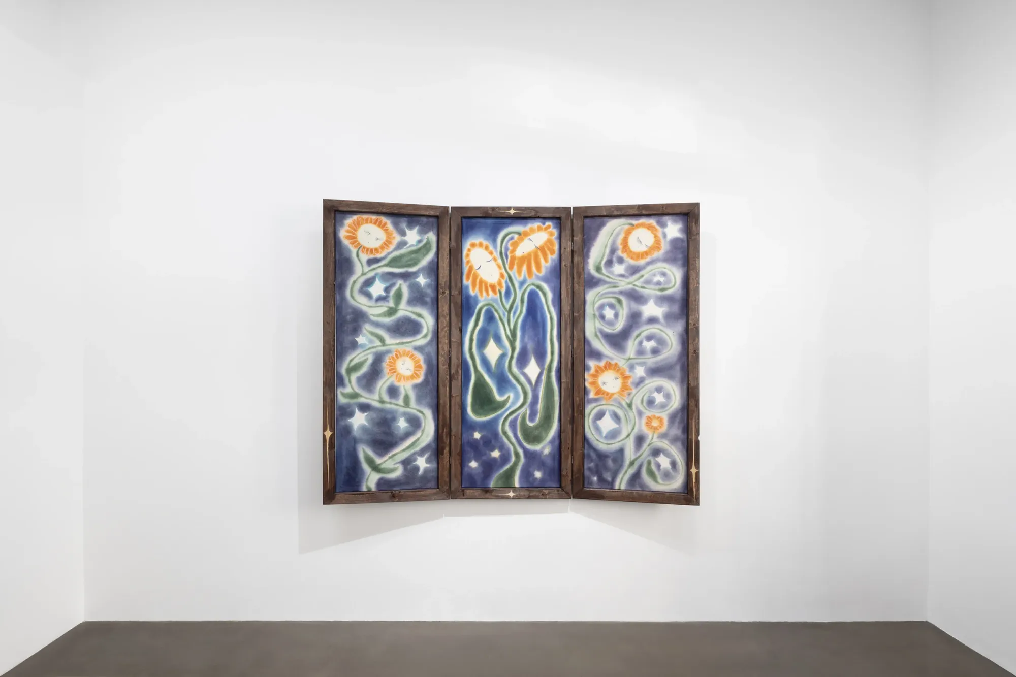 Olga Krykun, Stardust for Tomorrow, Clauda, Prague, 2026, three sunflowers with closed eyes on a deep blue painted triptych