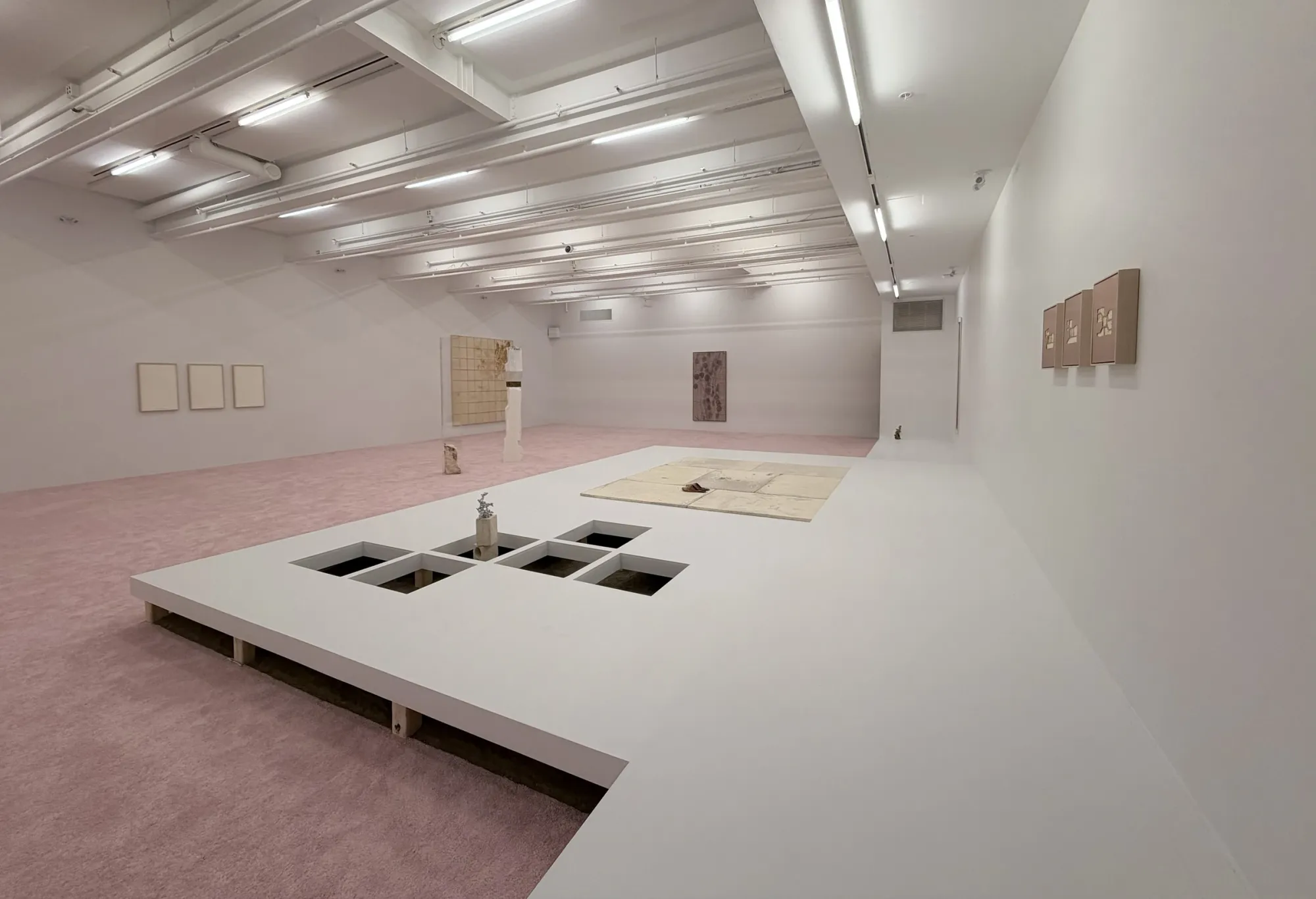 Patrick Bérubé, (Ce)pendant [(Now)ever], Musée d'art de Joliette, 2026, room view of the stone tile floor section and wall works
