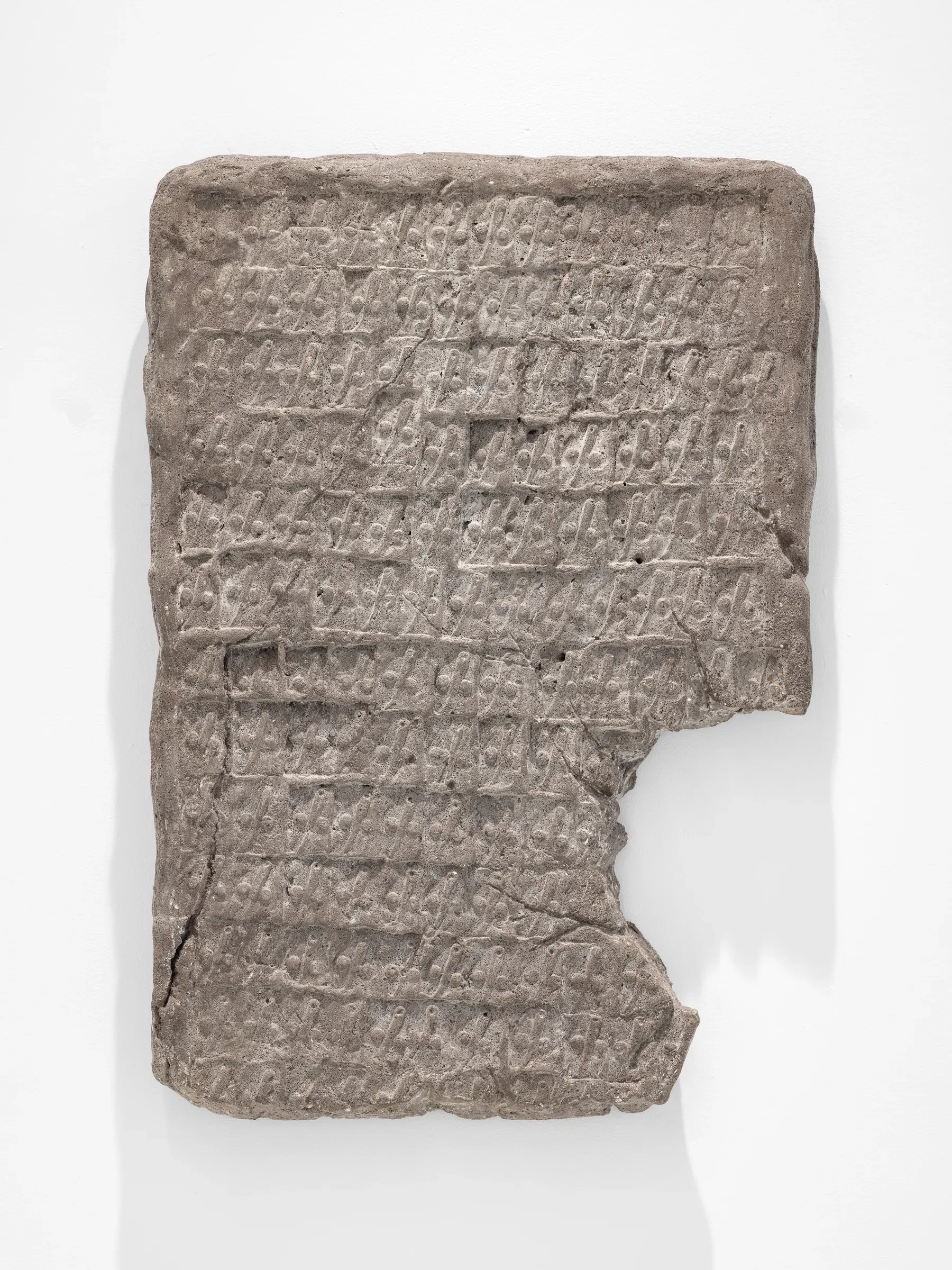 Miłosz Tomkowicz, Dwiescie harmat grzmialo, HOS Gallery, Warsaw, 2024, concrete relief tablet with rows of small carved figures