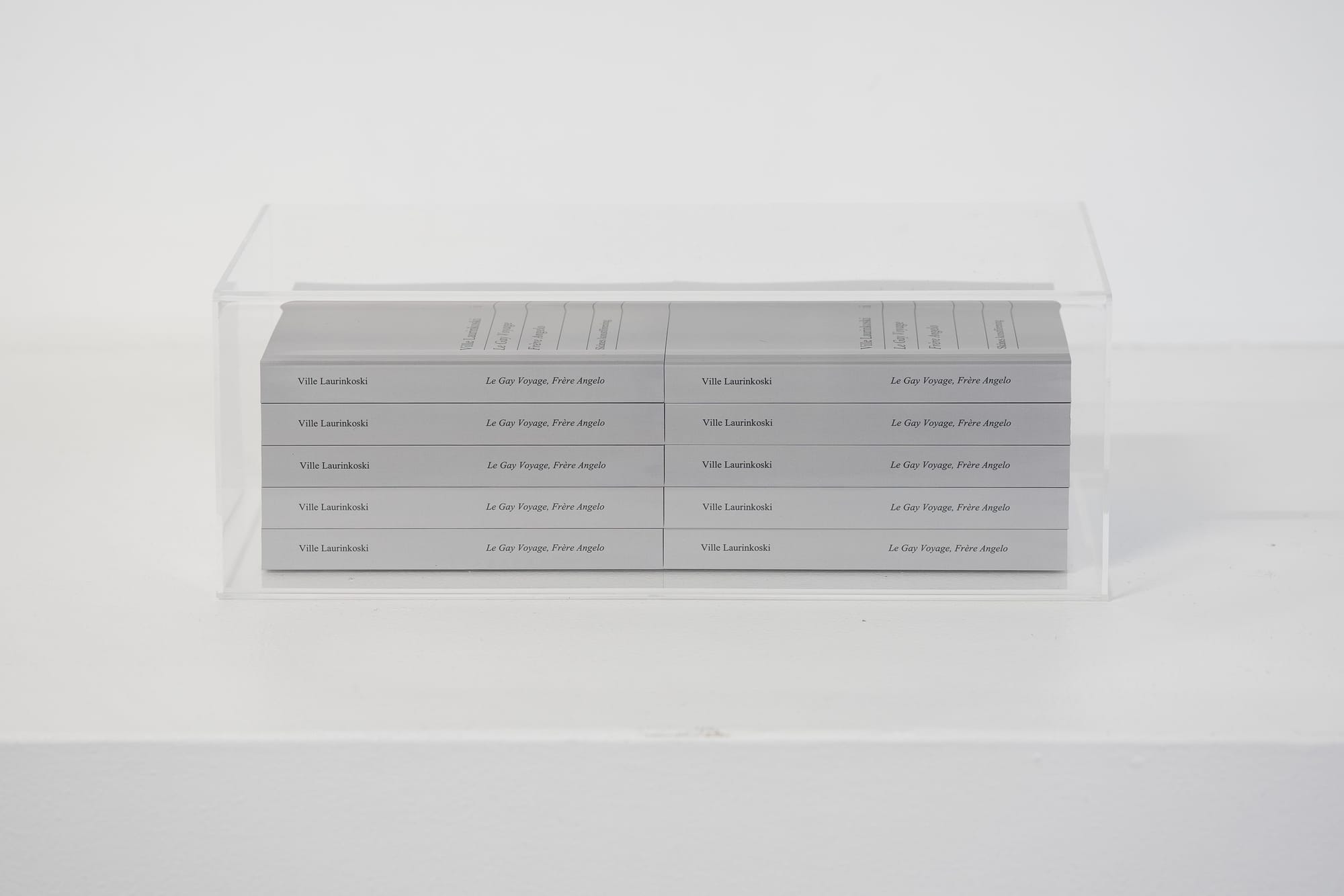 Ville Laurinkoski, Le Gay Voyage, Frère Angelo, Skånes konstförening, Malmö, 2026, book spines in acrylic display case