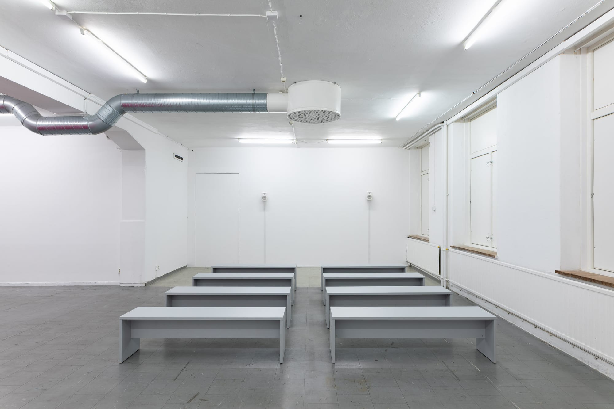 Ville Laurinkoski, Object of Devotion, Skånes konstförening, Malmö, 2026, benches facing wall with two speakers catapult contemporary exhibition review