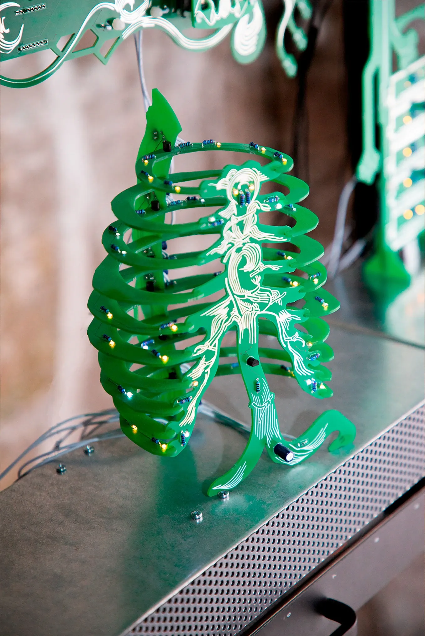 Exhibition review of Jaakko Myyri: White Nights at AaltoSiilo, Oulu, 2026, close-up detail showing a green circuit board etched with rib-like anatomy.