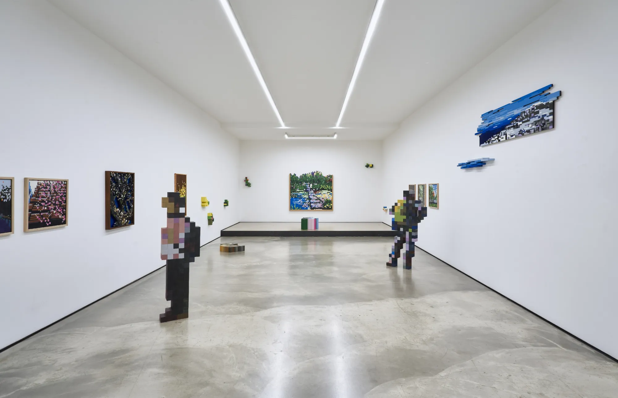 Artist Profile Feature: Jaebum Joo, studio practice and artwork at Hakgojae Gallery, Seoul, 2026. Room view with two figure sculptures and a framed garden painting.