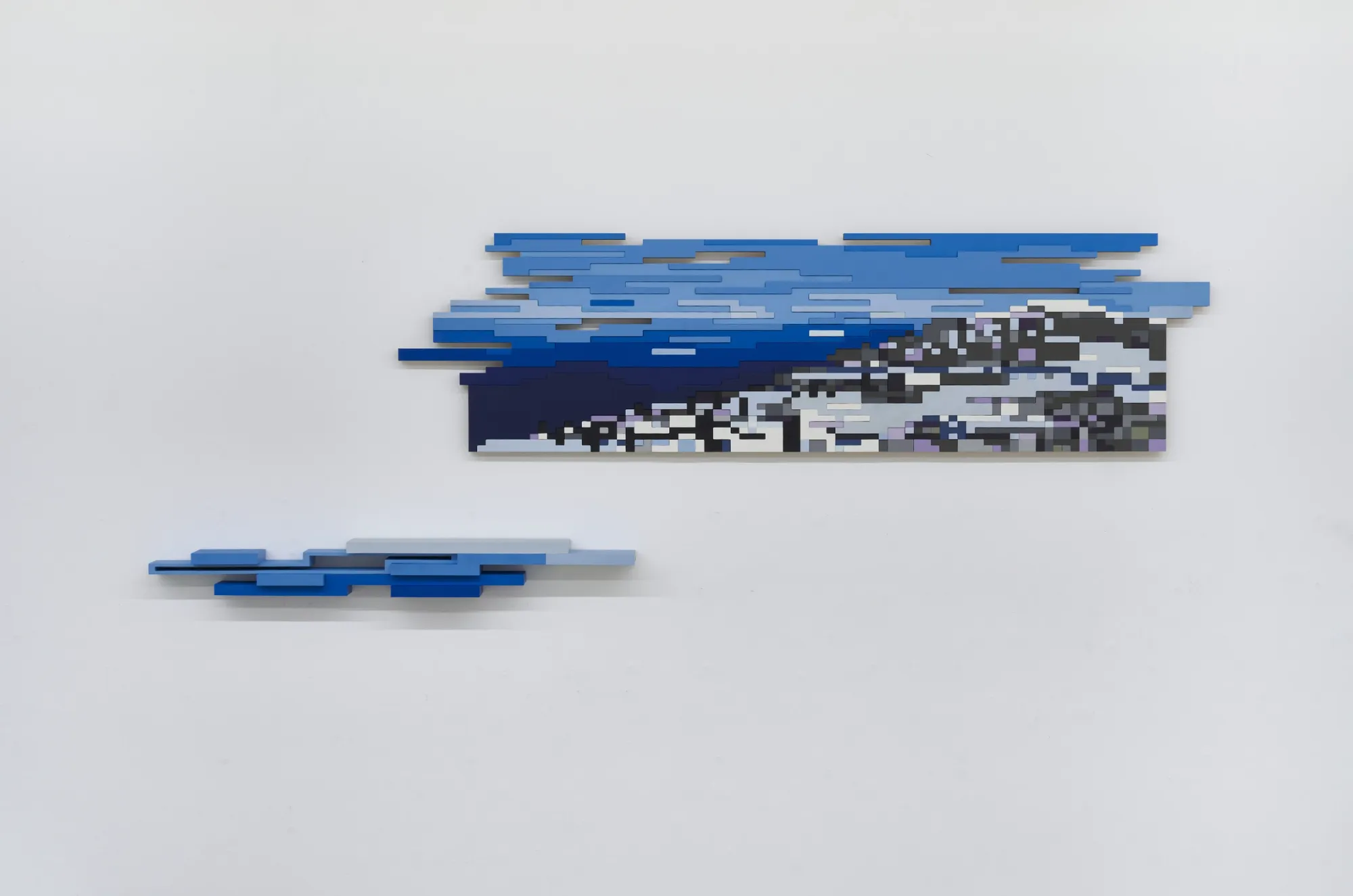 Artist Profile Feature: Jaebum Joo, studio practice and artwork at Hakgojae Gallery, Seoul, 2026. Two blue wood wall reliefs suggesting layered coastline and sky.