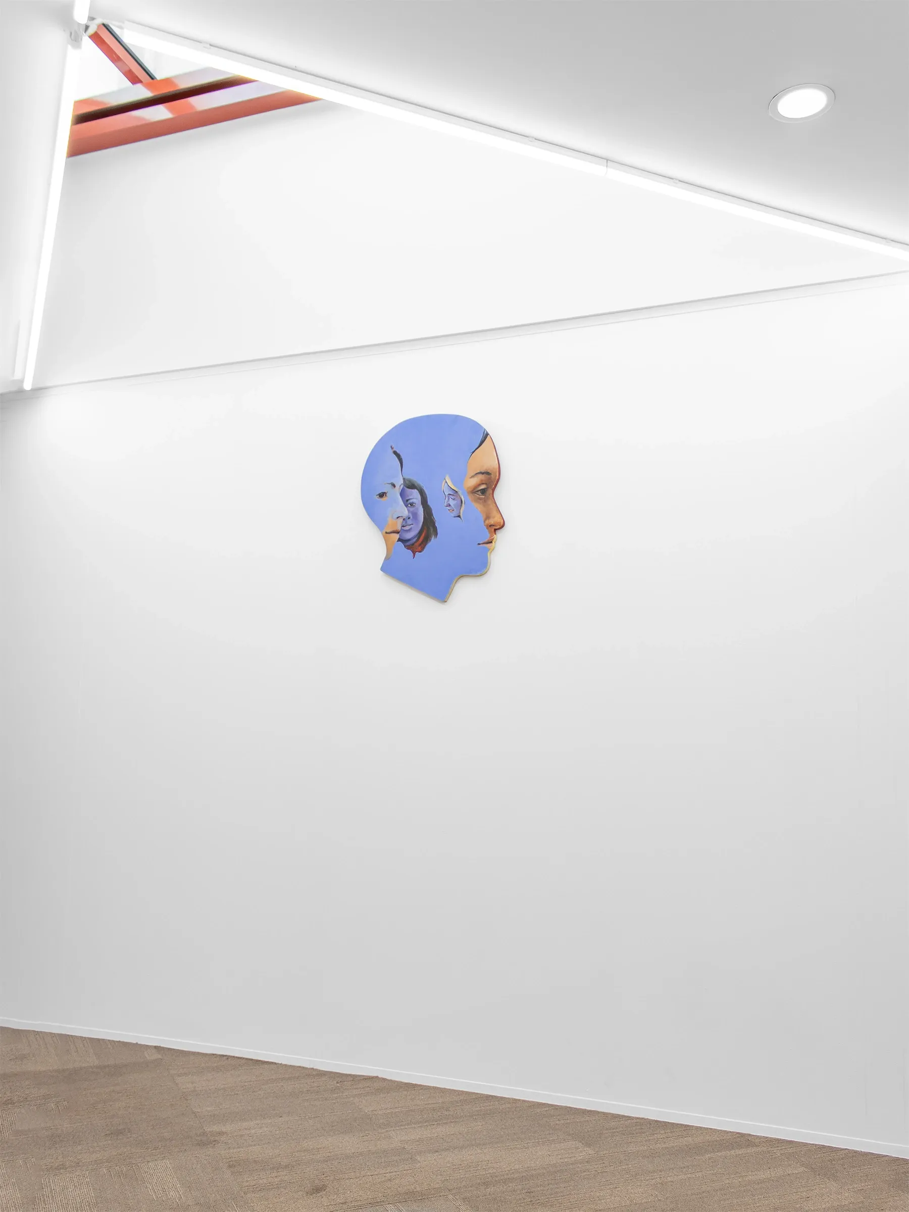 Exhibition review of Robert Brambora: Memories at Emergency Space, Paris, 2026. Painted wood cutout of a head in profile showing layered translucent faces