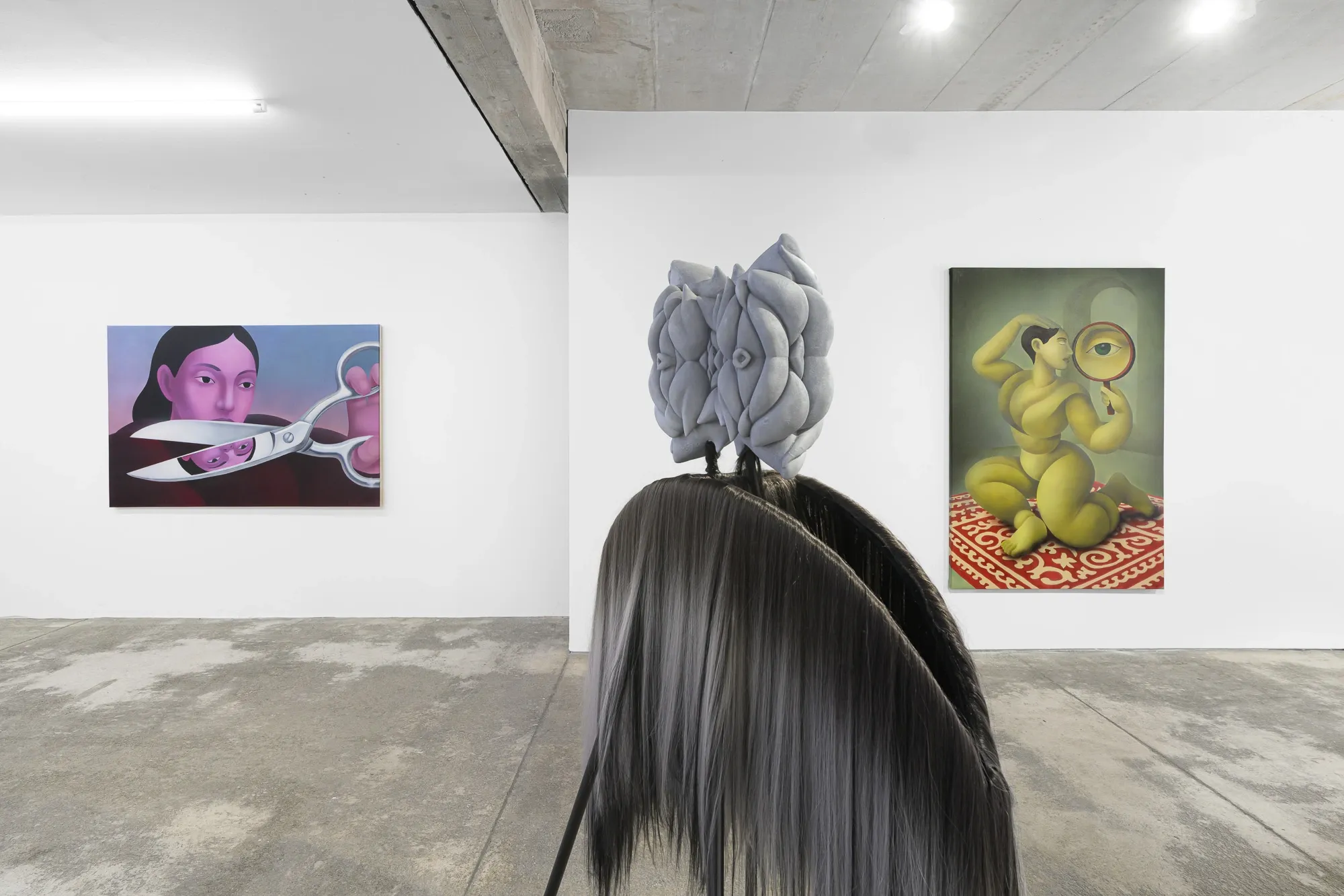 Exhibition review of Soft Power: gallery wall with paintings and a grey-maned sculpture on a tripod stand, Umrian Gallery, Bratislava, 2026.