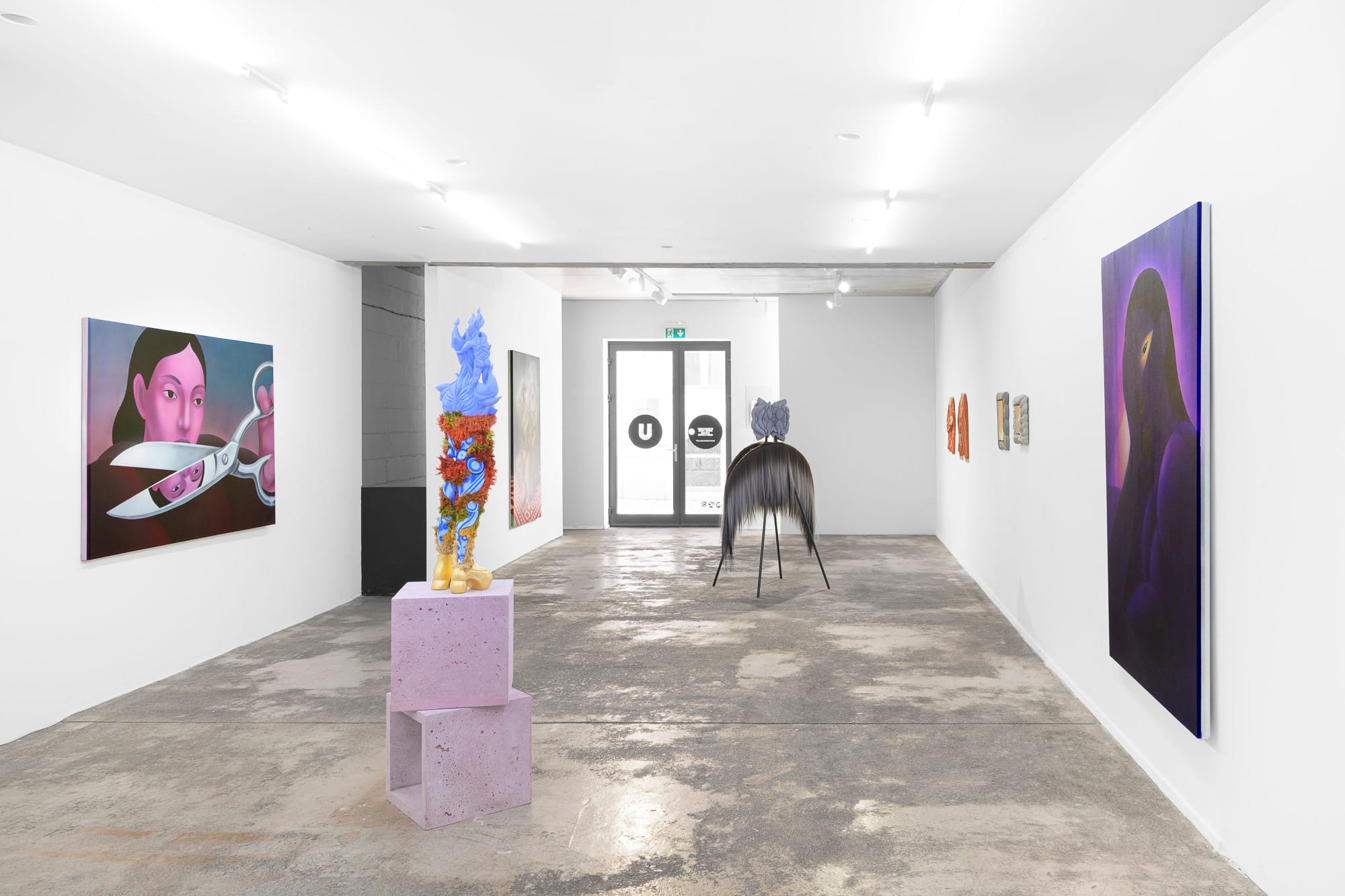 Exhibition review of Soft Power: gallery room with doorway, sculpture and paintings on either side, Umrian Gallery, Bratislava, 2026.