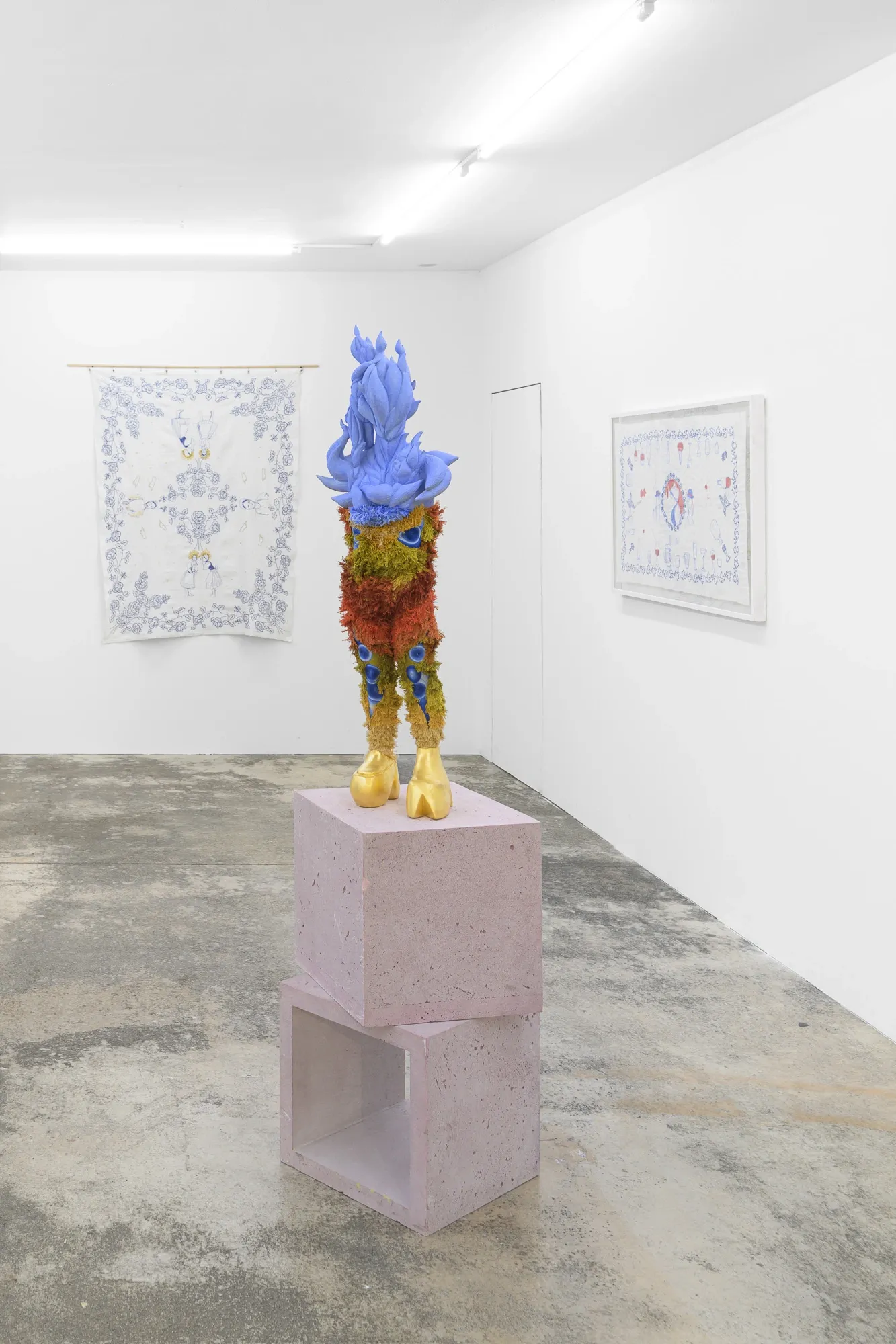 Exhibition review of Soft Power: sculpture by Magdaléna Roztočilová on a pink concrete plinth, flanked by framed and hanging works.