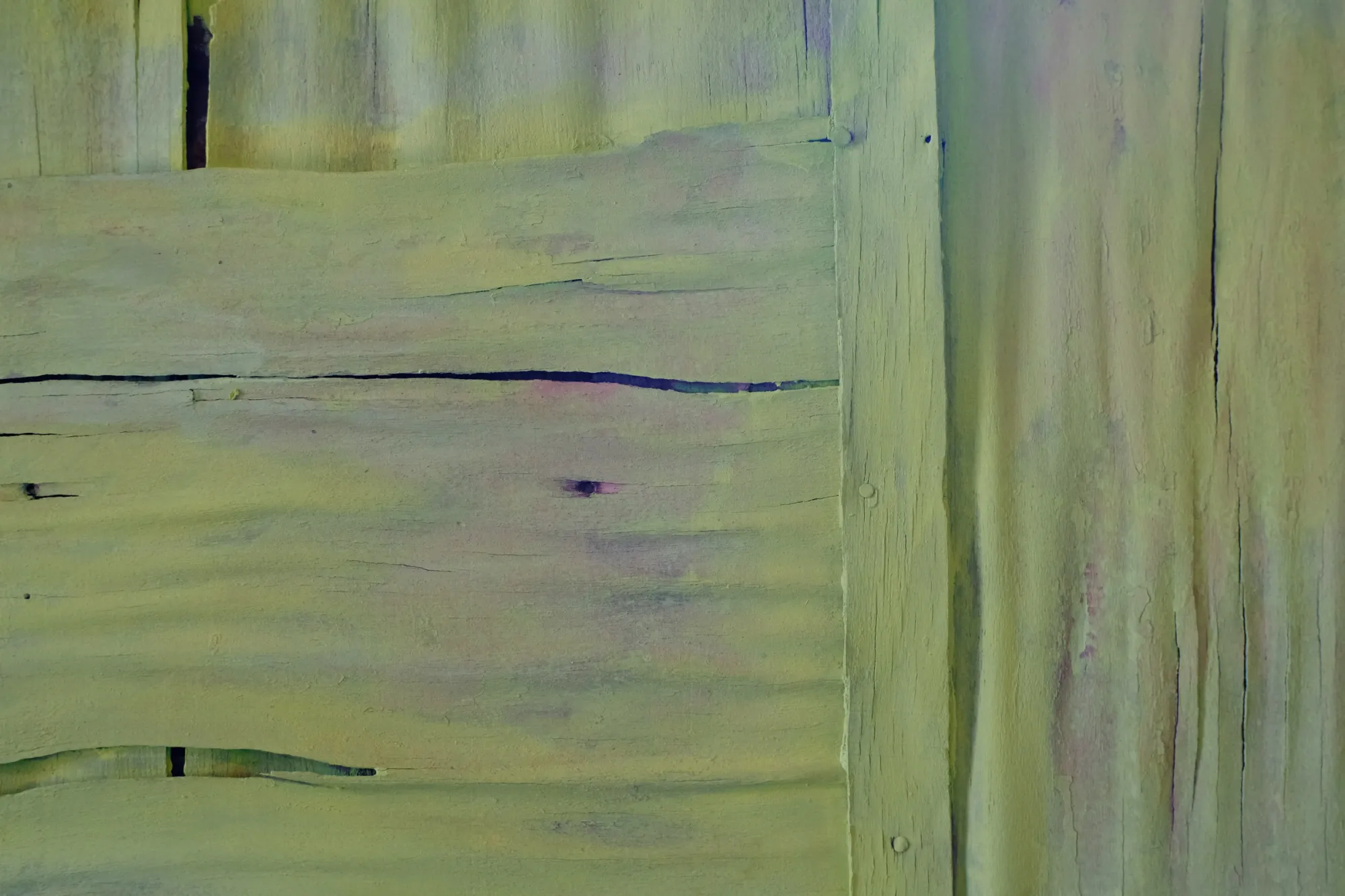 Exhibition review of Tsvetomira Borisova: A Hot Day at lo3eto, Vetren dol, 2026. Close-up of a wooden wall showing pink and green brushstrokes beneath yellow paint.