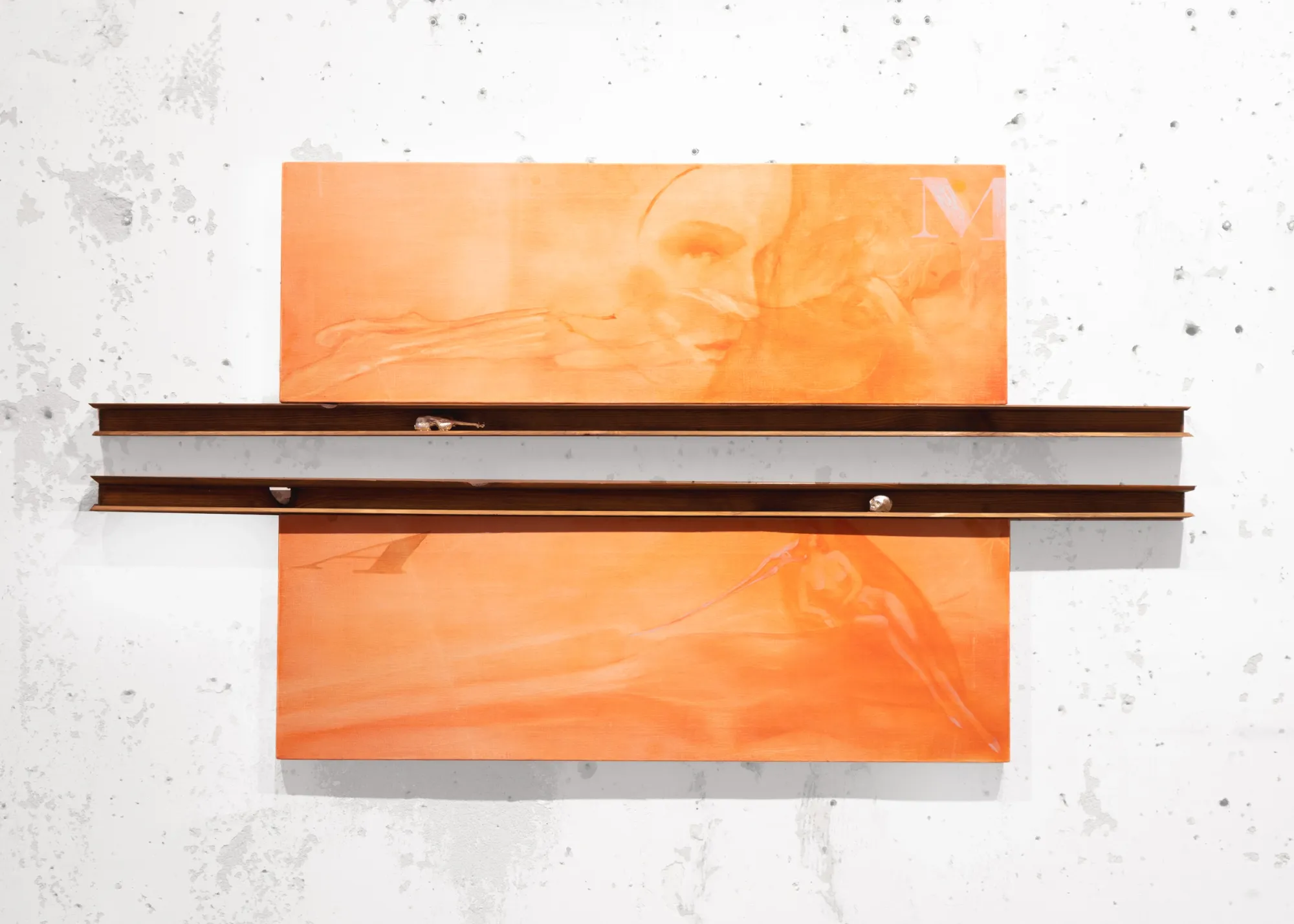 Exhibition review of Amelia Woroszyl: Silly! Devil! at Crum Heaven, Stockholm, 2026. Two orange fabric panels lettered M and A, crossed by dark wood and brass rails holding small metal charms.