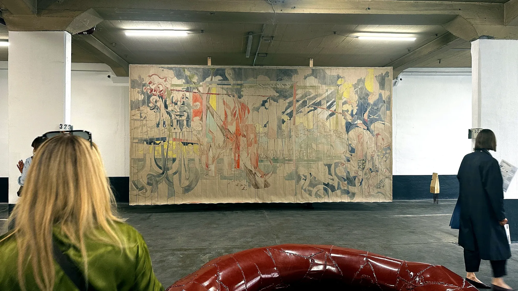 Installation view at Astoria Art Show Vienna 2026 with a large work by Maria Legat presented by Galerie3 and a detail of a Franz West sculpture presented by W&K – Wienerroither & Kohlbacher in the foreground.