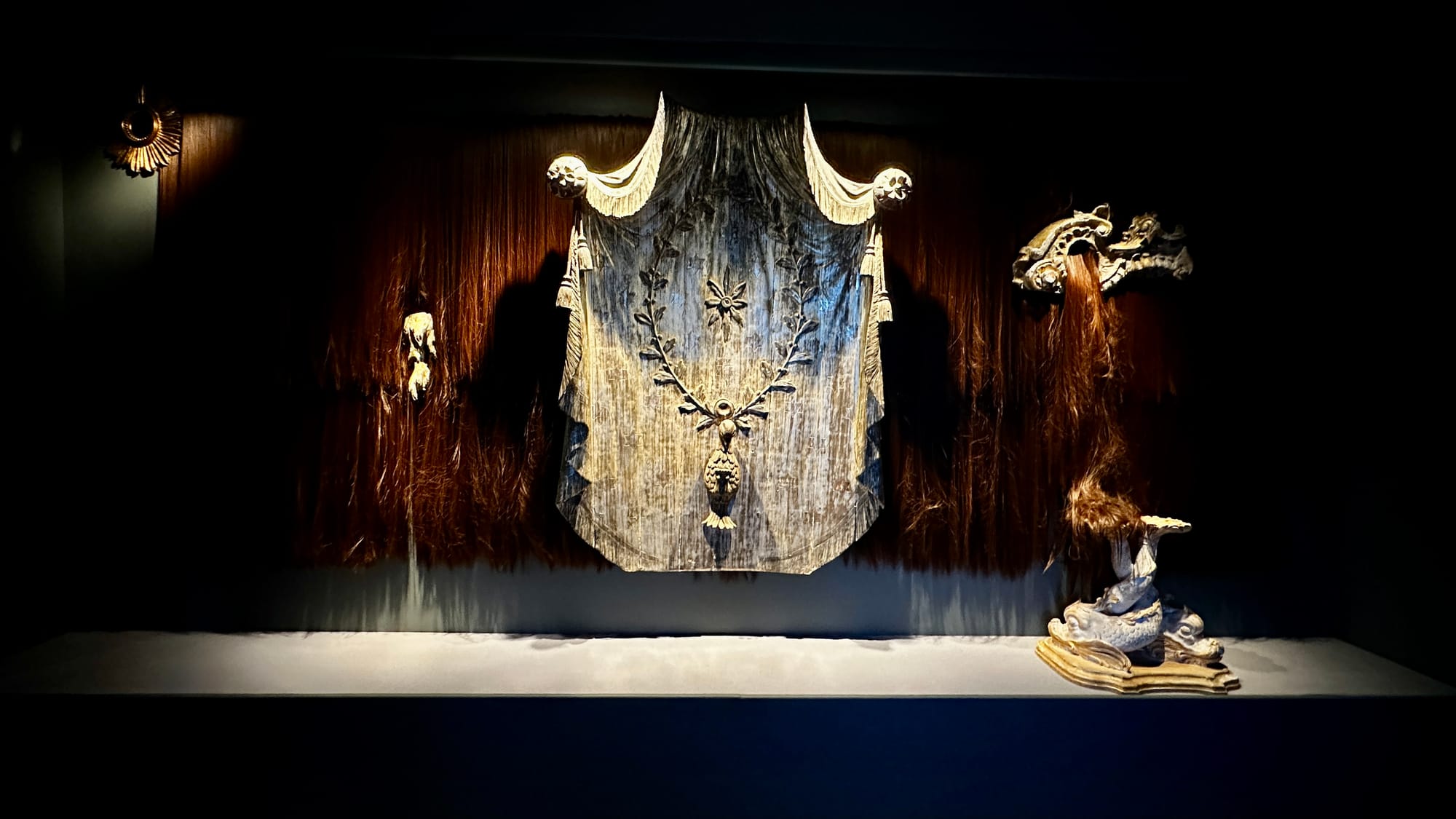 Jakob Lena Knebl’s All Seeing I, a dark textile installation with long hair-like material at the Marmorschlössl.