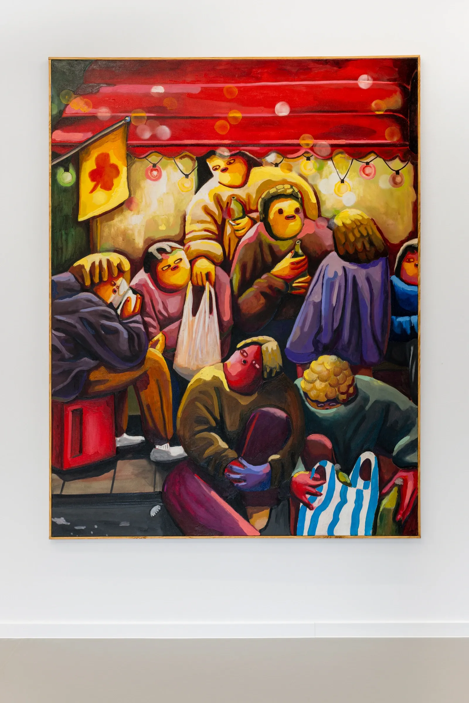 Exhibition review of Nina Bachmann: Schieben, Drücken, Treiben at Galerie Gegen & Lücke, Berlin, 2026. A group gathered under a red market awning strung with lights, holding bottles and plastic bags.