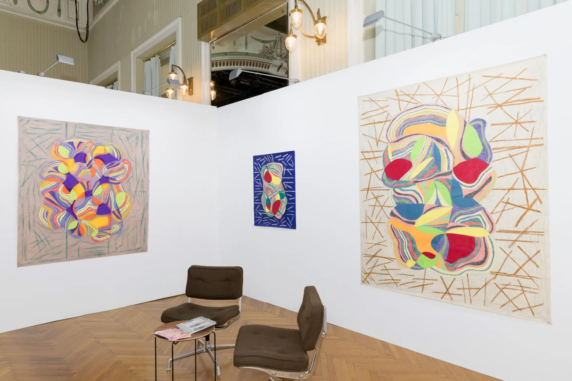 Artist Profile Feature: Sophie-Luise Passow, artwork at Parallel Vienna, 2026. Booth corner with three linen works, two chairs, ornate hall above.