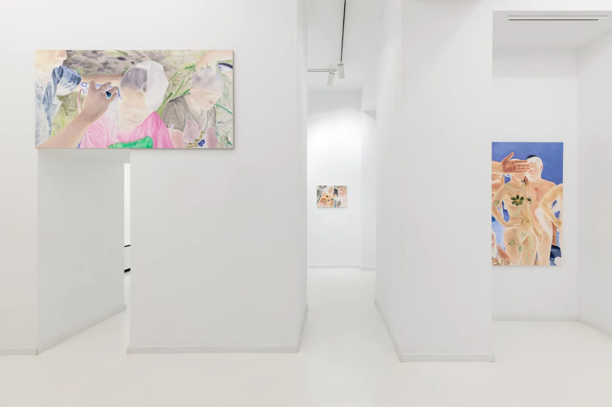 Exhibition review of Zofia Pałucha: Mother of One at HOS Gallery, Warsaw, 2026. View through white doorways, a long canvas above, a figure painting to the right.