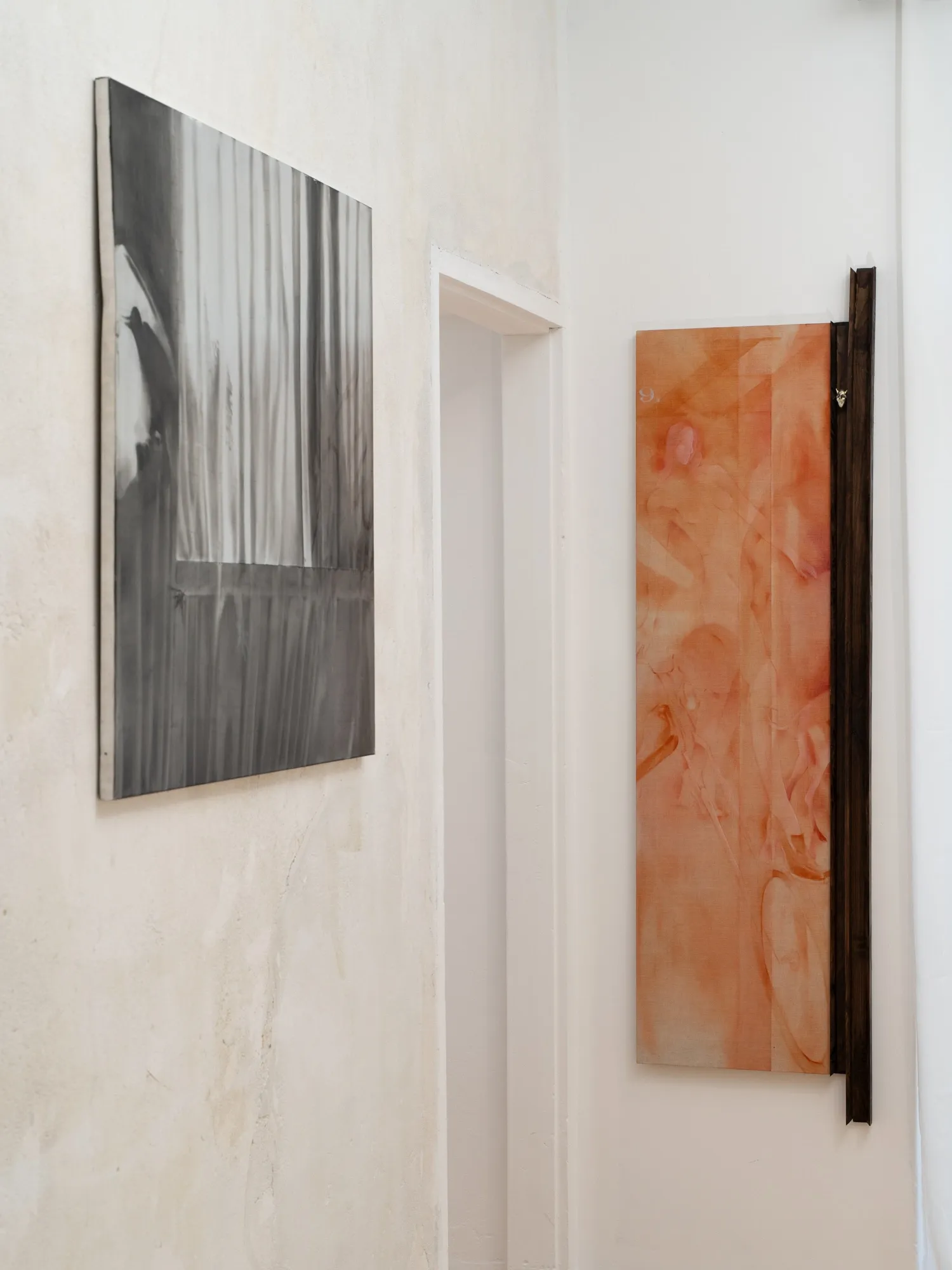 Amelia Woroszył, MISE EN, Warsaw: orange canvas with a dark wooden beam beside a grey painting on a plastered wall.