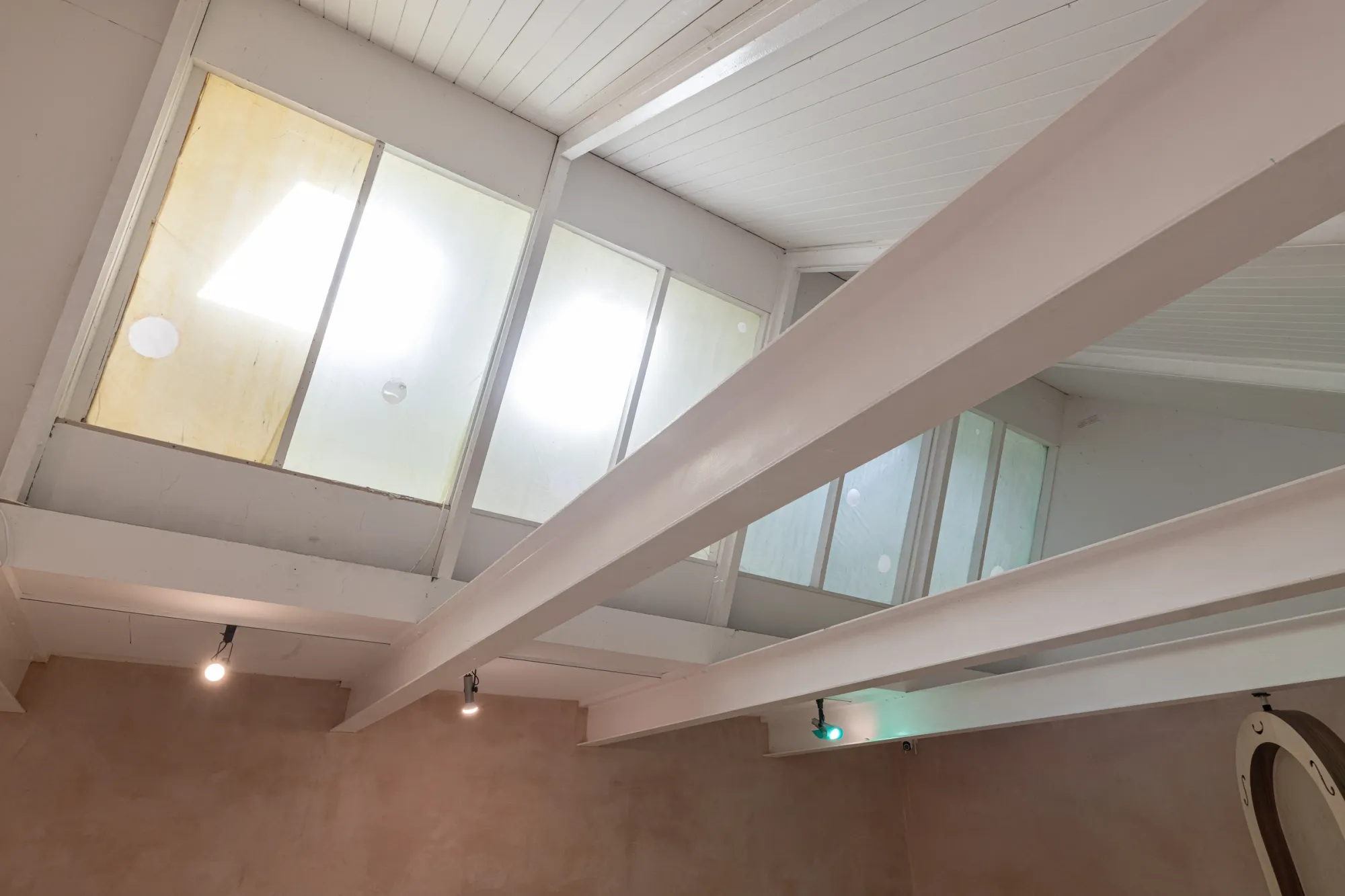 Finbar Prior's The Mucous Vaults at OUTPOST Gallery, Norwich, 2026, showing translucent membranes across gallery windows with circular marks.
