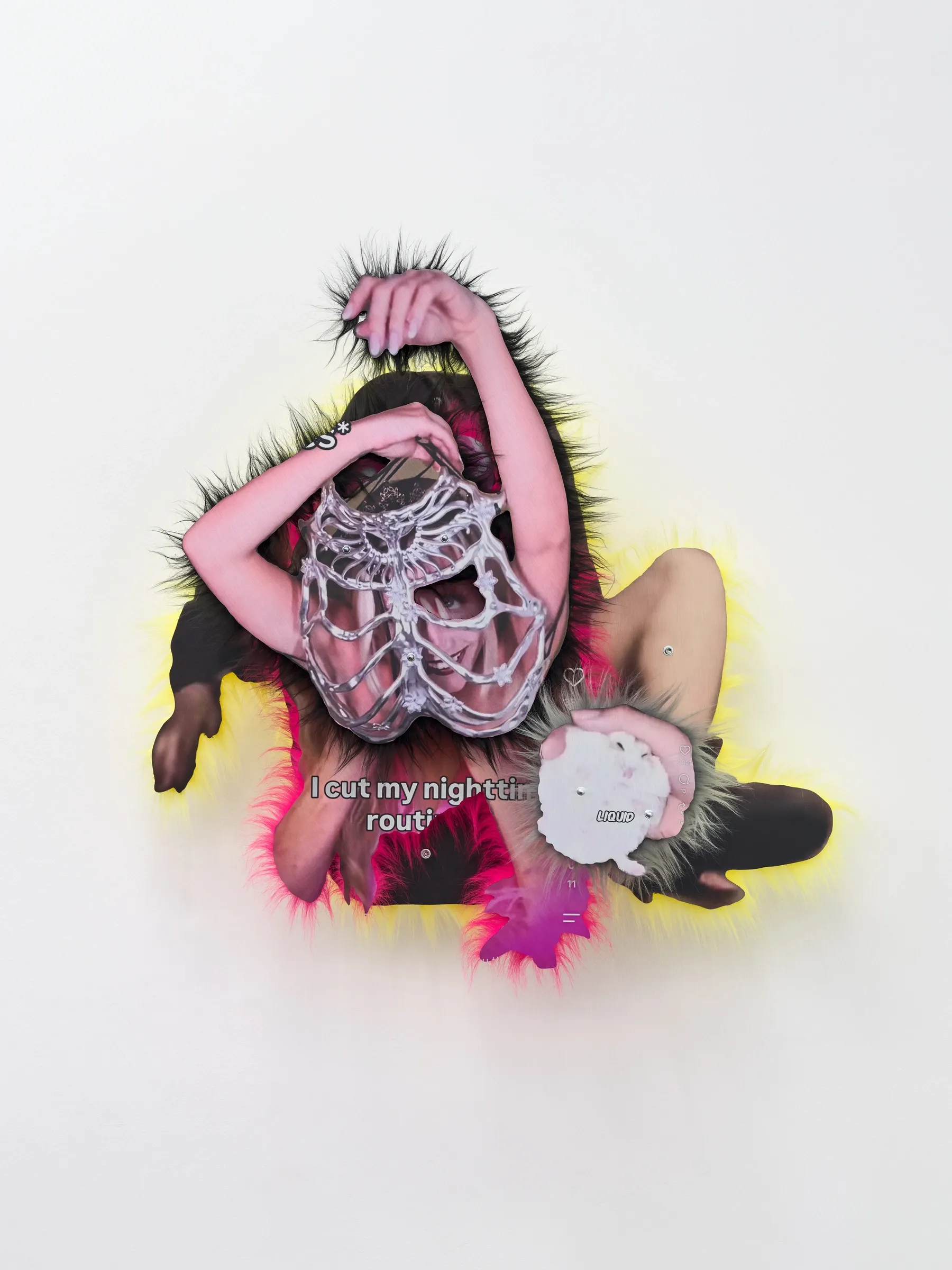 Exhibition review of Iris Helena Hamers: ~^-.3N3RGY_4NG3L.-^~ at PAW, Düsseldorf, 2026. Wall work of a figure covering its head with a mesh mask, edged with black fur and yellow and pink color.