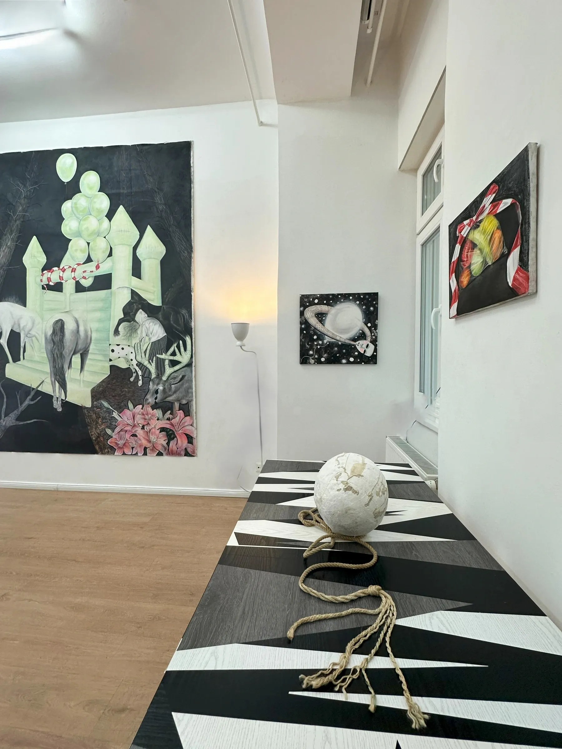 Karolína Netolická, LiTE-HAUS, Berlin: pastel painting of a pale green bouncy castle with animals above a patterned bench and white sphere.