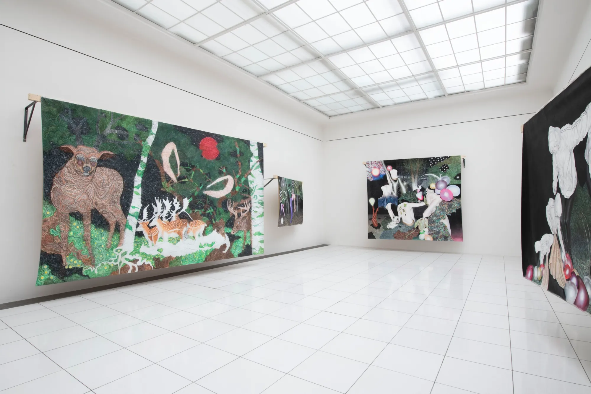 Karolína Netolická, Nová Síň, Prague: large unframed pastel canvases hang from wooden battens in a white skylit room.