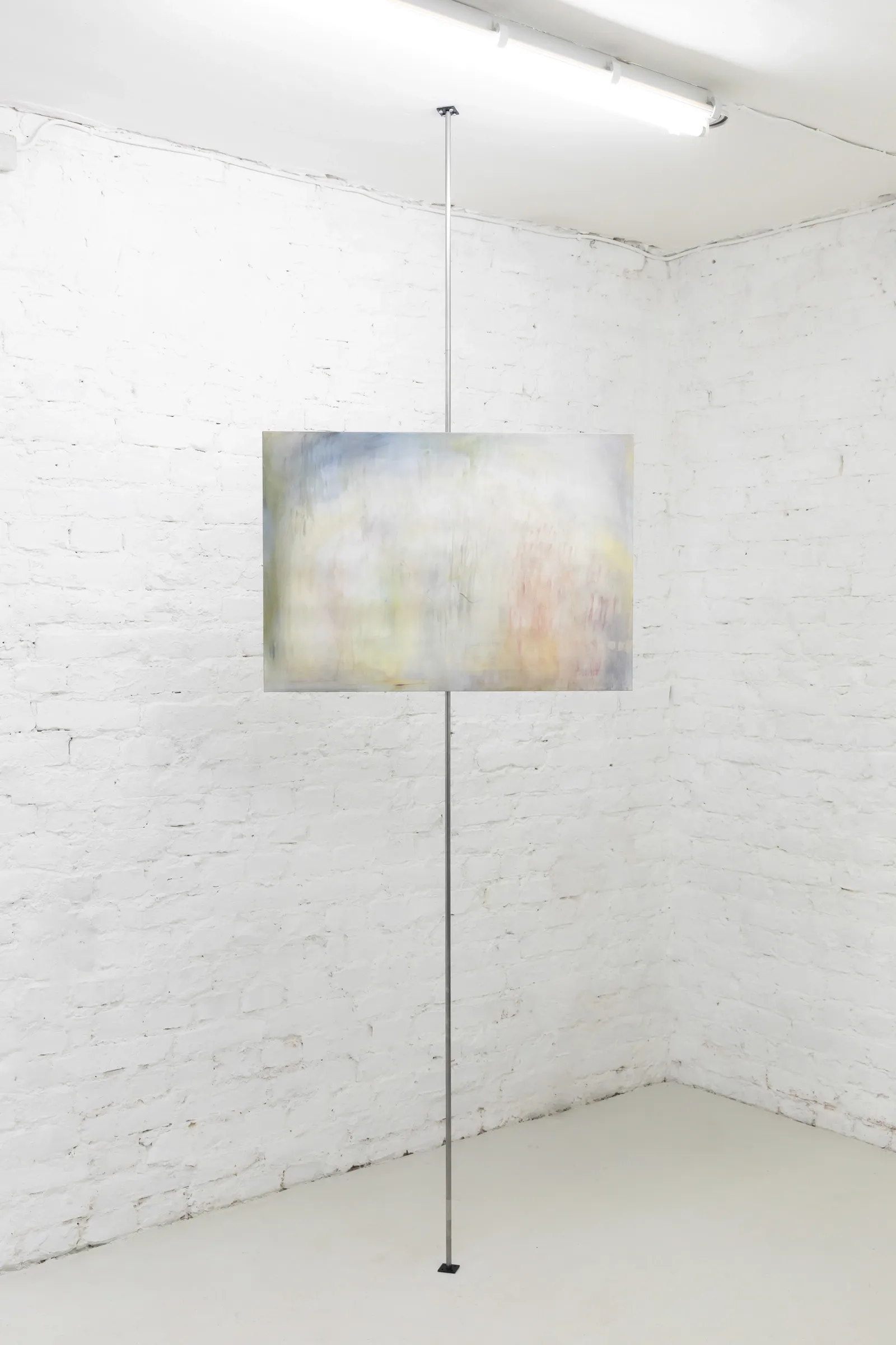 Exhibition review of Krys Huba: falling into you at soft power, Berlin, 2026. Small blurred pastel painting mounted on a single steel pole.