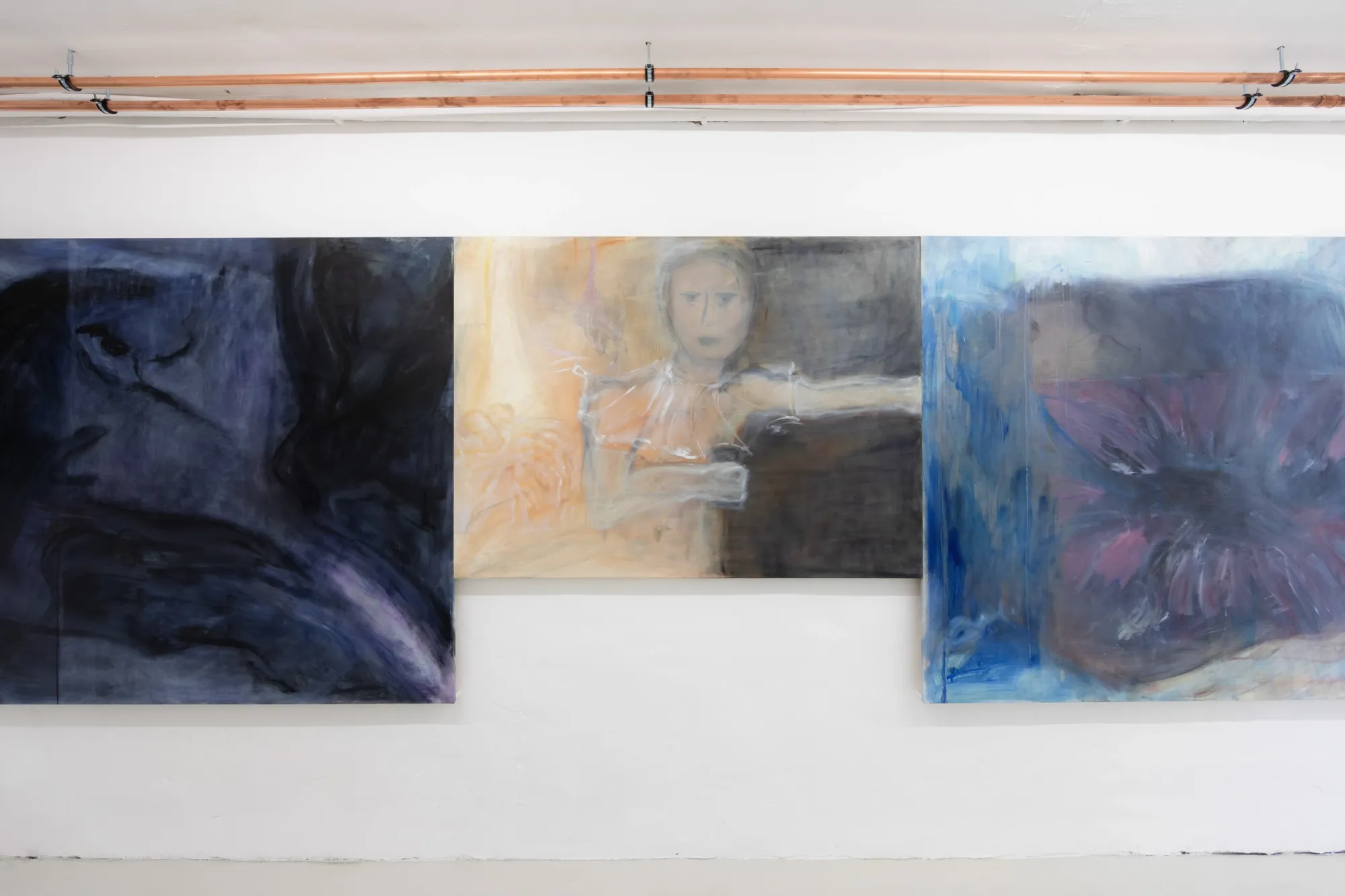 Exhibition review of Krys Huba: falling into you at soft power, Berlin, 2026. Dark, orange and blue paintings with a figure and a red flower shape.