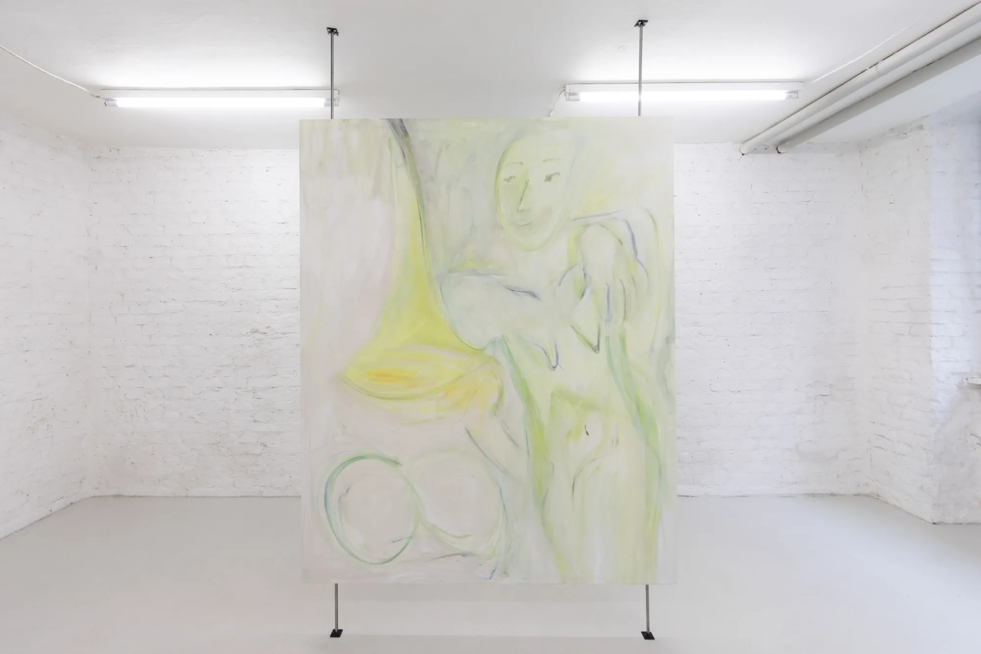 Exhibition review of Krys Huba: falling into you at soft power, Berlin, 2026. Large canvas with yellow-green figure lines, hung freestanding on poles.