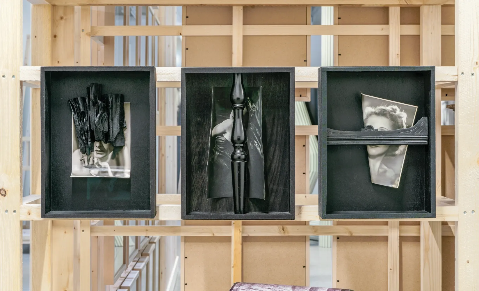 Lucia Tallová, PalaisPopulaire, Berlin: three black boxes with charcoal over a portrait, a turned baluster and a cut portrait.