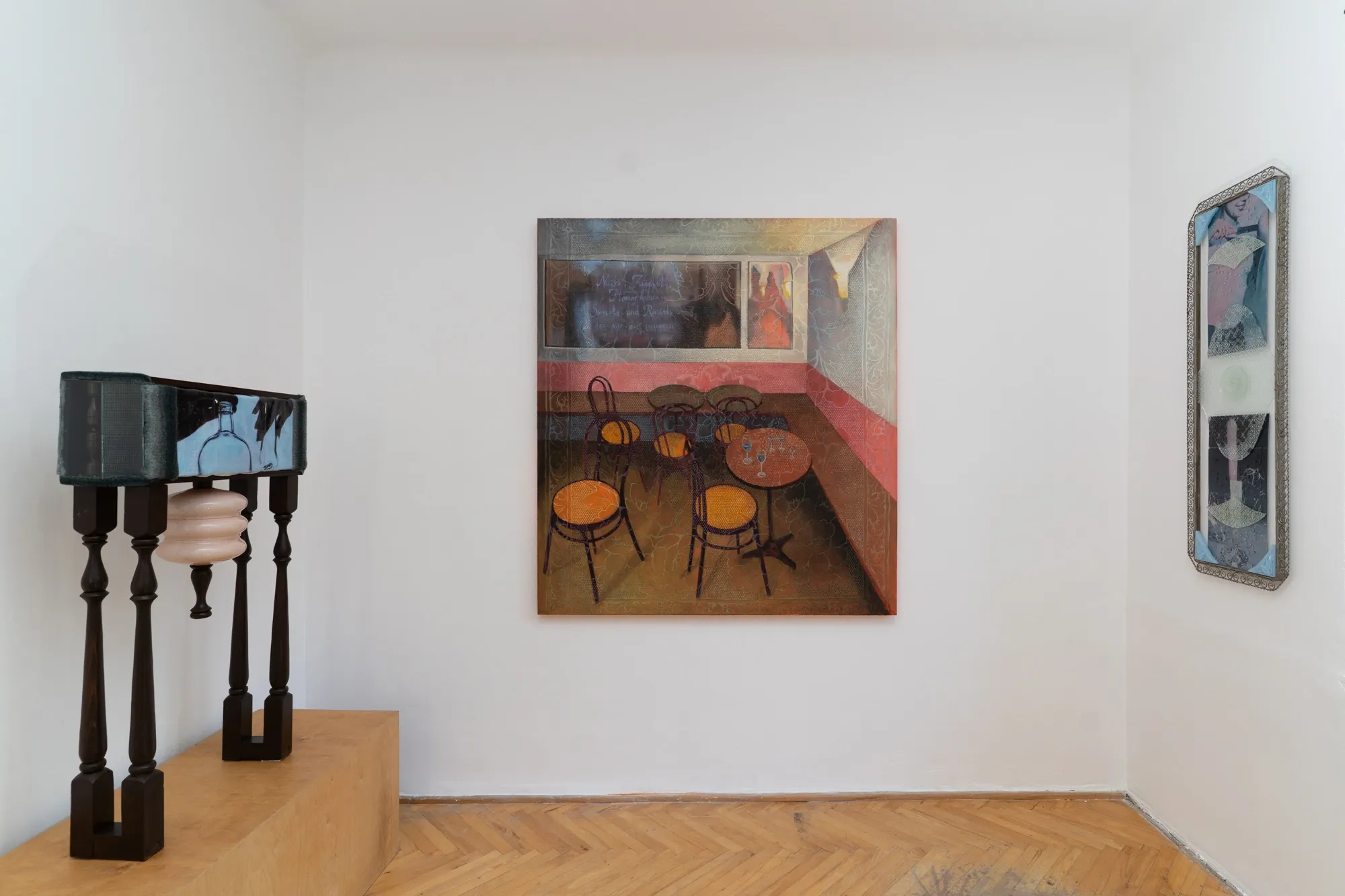 Gutkowska, Szablak, Wierzbicka, Woroszył, MISE EN, Warsaw: painted café interior, a bottle painted on a velvet-edged table with wooden legs, a framed glass panel