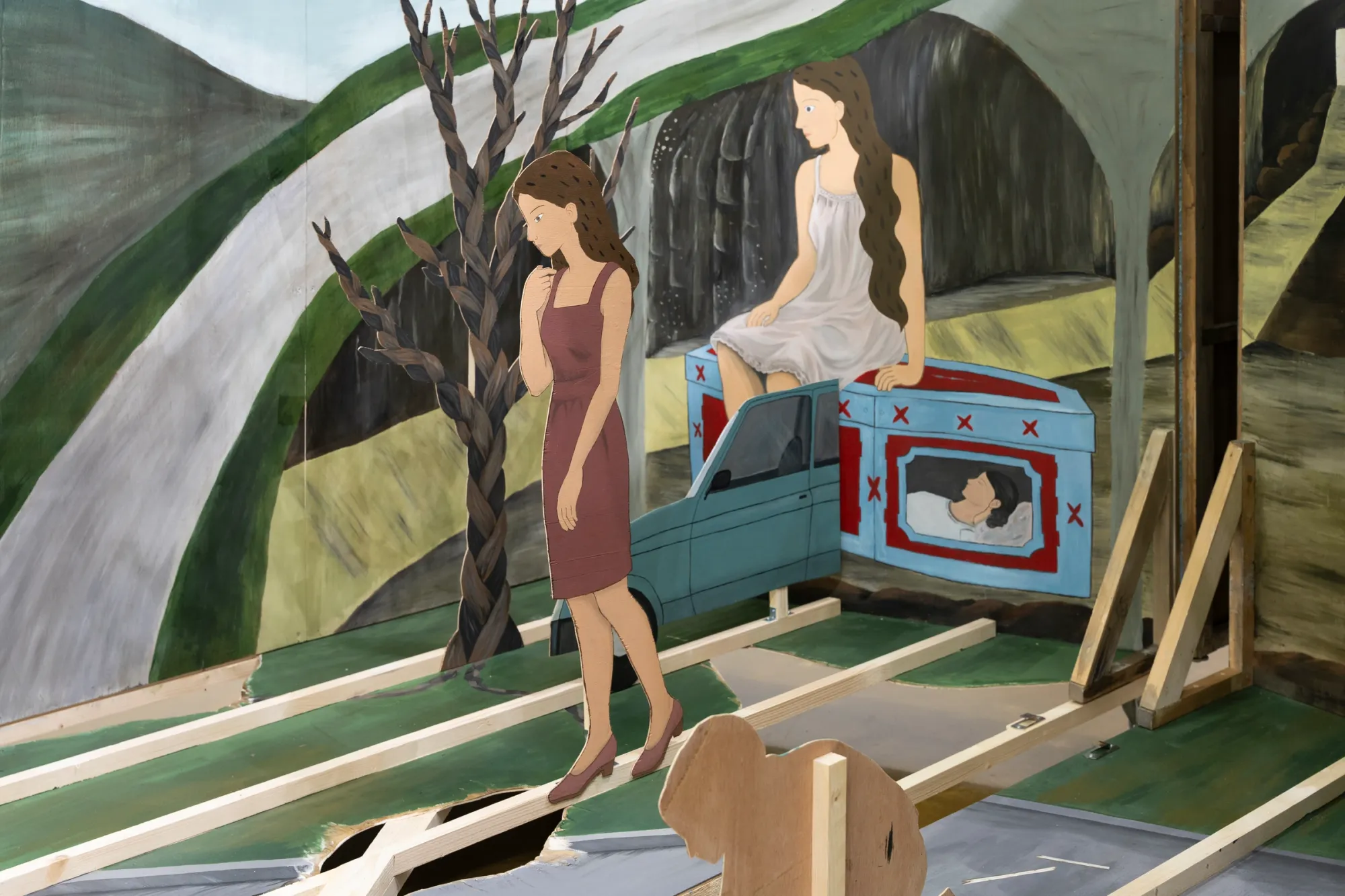 Seongeun Lee, Cheongju Art Studio, Cheongju: painted cut-out women, one in a maroon dress by a braided tree, one seated above a grey car.
