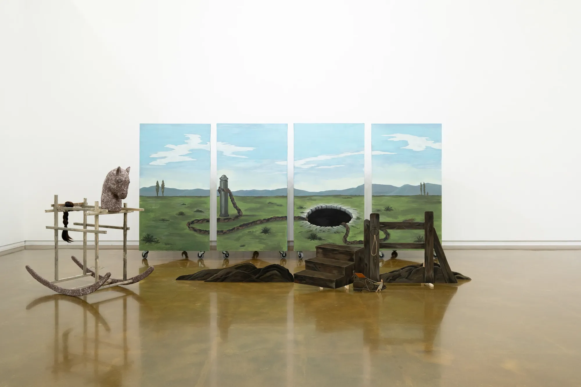 Seongeun Lee, Cheongju Art Studio, Cheongju: columns painted with a green meadow, a round black hole and a braided rope under a pale sky.