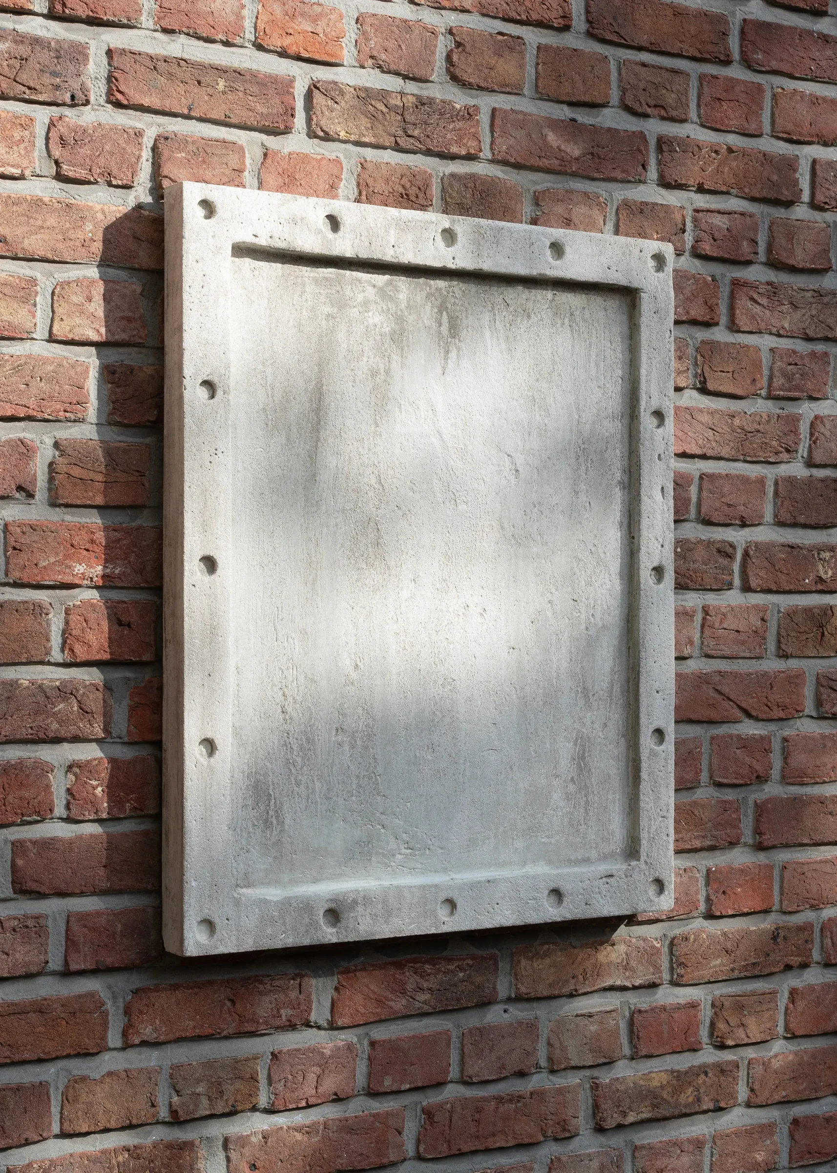 Exhibition review of Simon Bultynck: A. Aubry, A. Colin, P. Lippens, A. Oosterlinck, C. Wynants at CONVENT Space for Contemporary Art, Ghent, 2026. Close-up of a pale concrete panel with a recessed field and bolt holes against red brick.