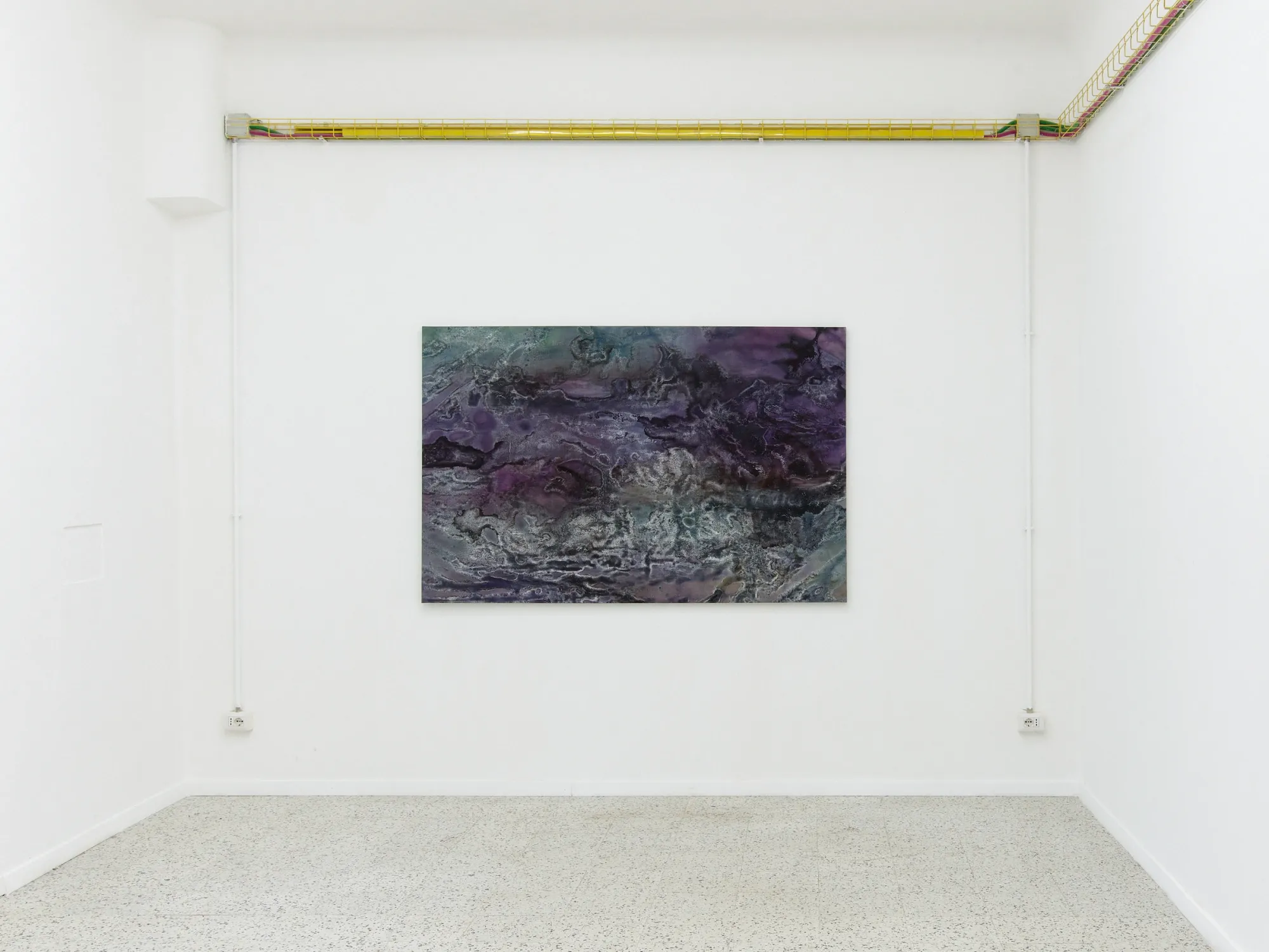 Taylah Hasaballah, INDICATRIX at The Address, Milan, 2026. Purple and teal marbled painting on a white wall below a yellow pipe.